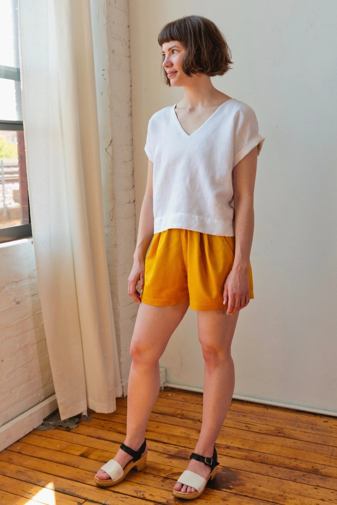 Puff Shorts in gold raw silk and Cuff Tee in white linen