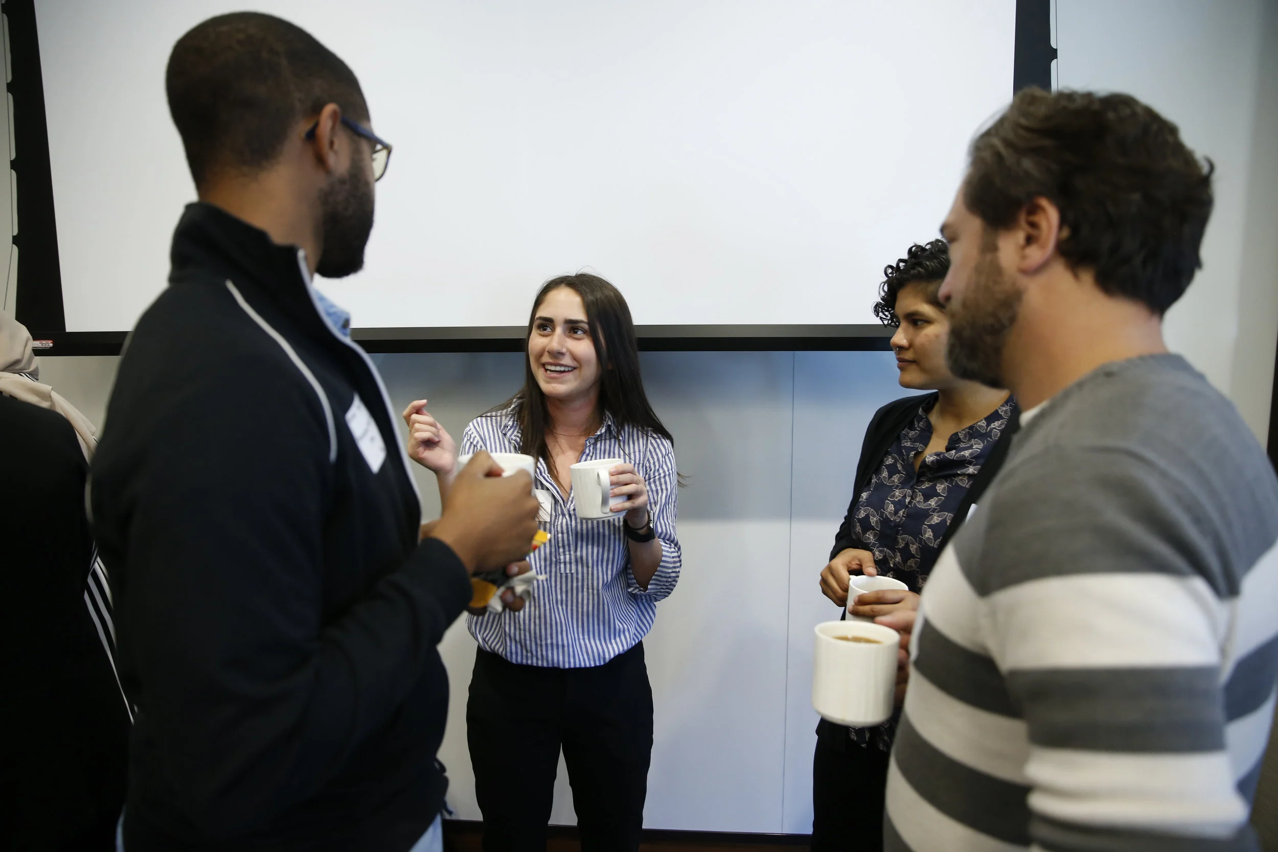 Graduate students bonding: Psychology Gerald Higginbotham, M.A. (left) and Lee Lazar (center left) along with TFFT students, Mrittika Sarin (center right) and Matthew Johnson (right)