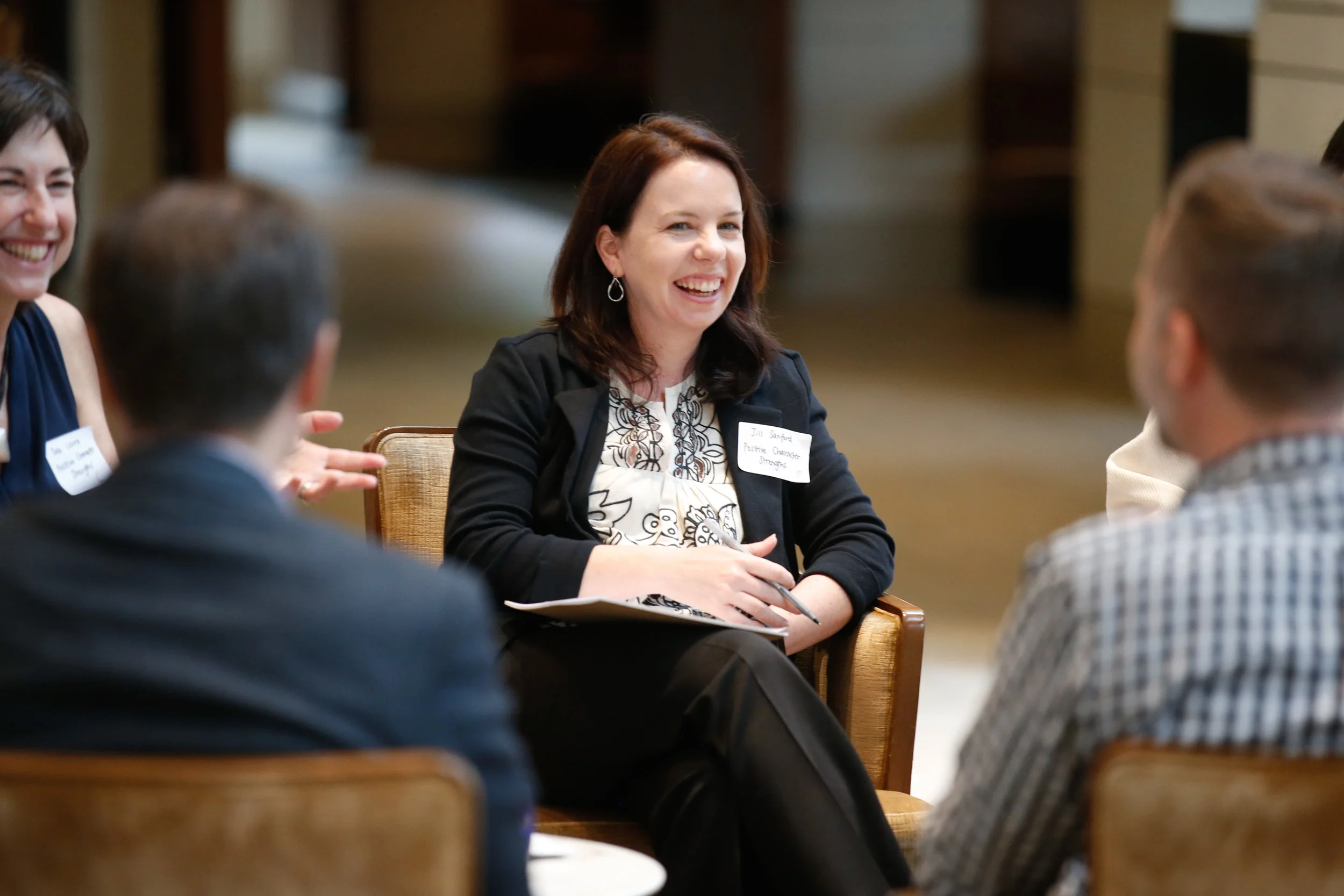 Netflix Jill Sanford engaging in group discussion on developing positive character strengths in youth media.