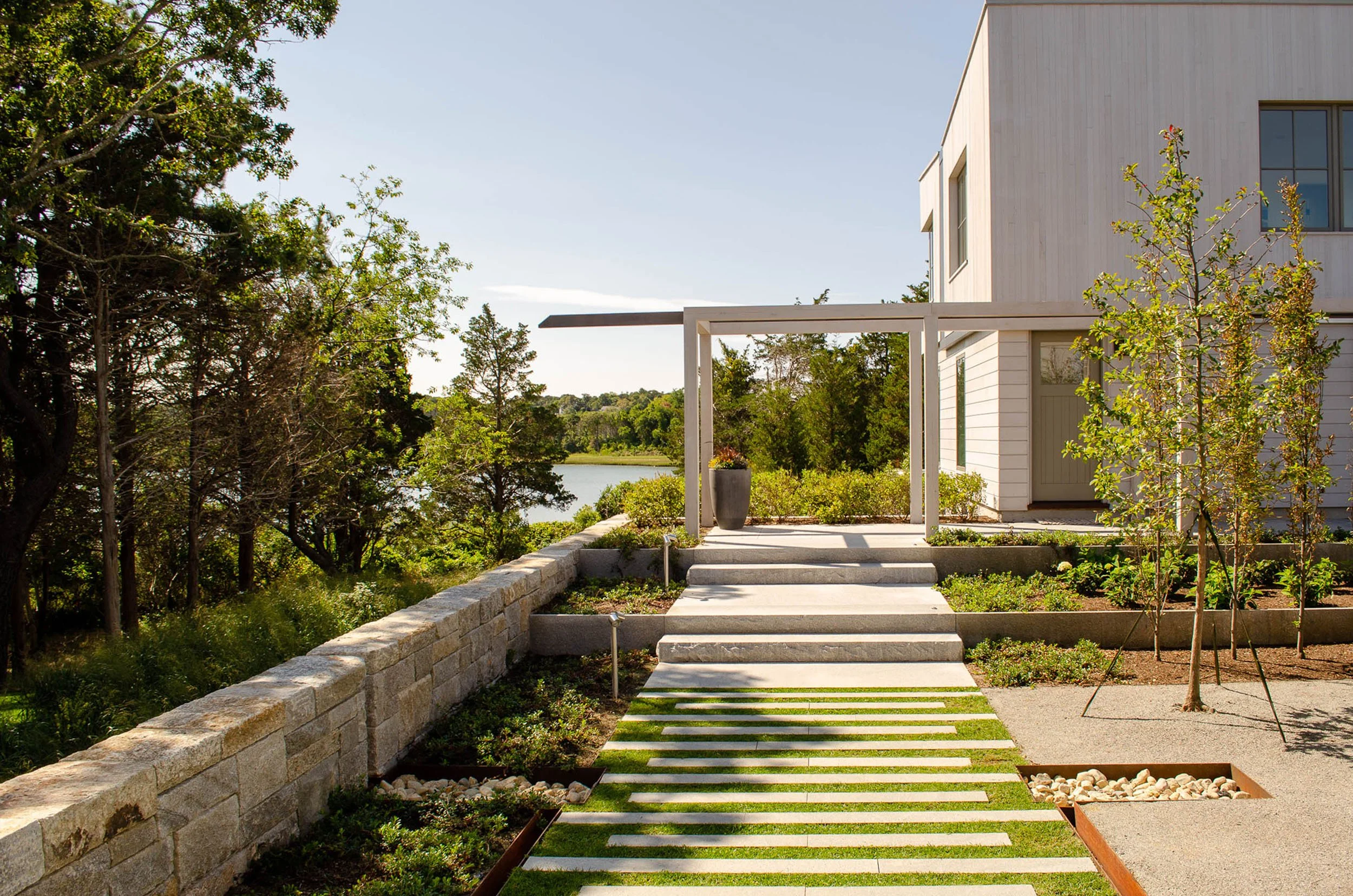 Coastal residential garden overlooking Nauset Harbor and tidal pond in Orleans, MA on Cape Cod, designed by Landschop Landscape Architects