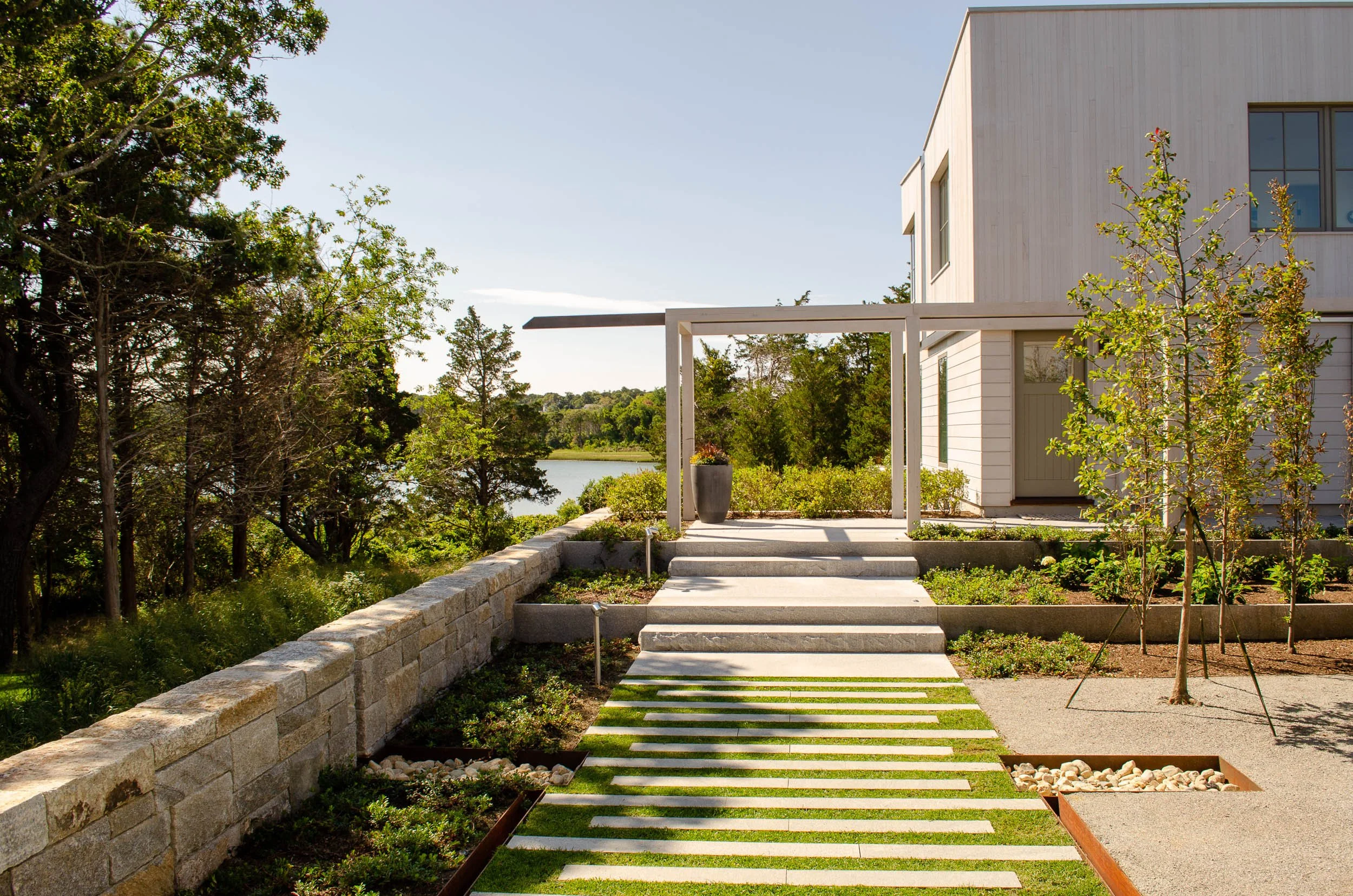 Coastal residential garden overlooking Nauset Harbor and tidal pond in Orleans, MA on Cape Cod, designed by Landschop Landscape Architects