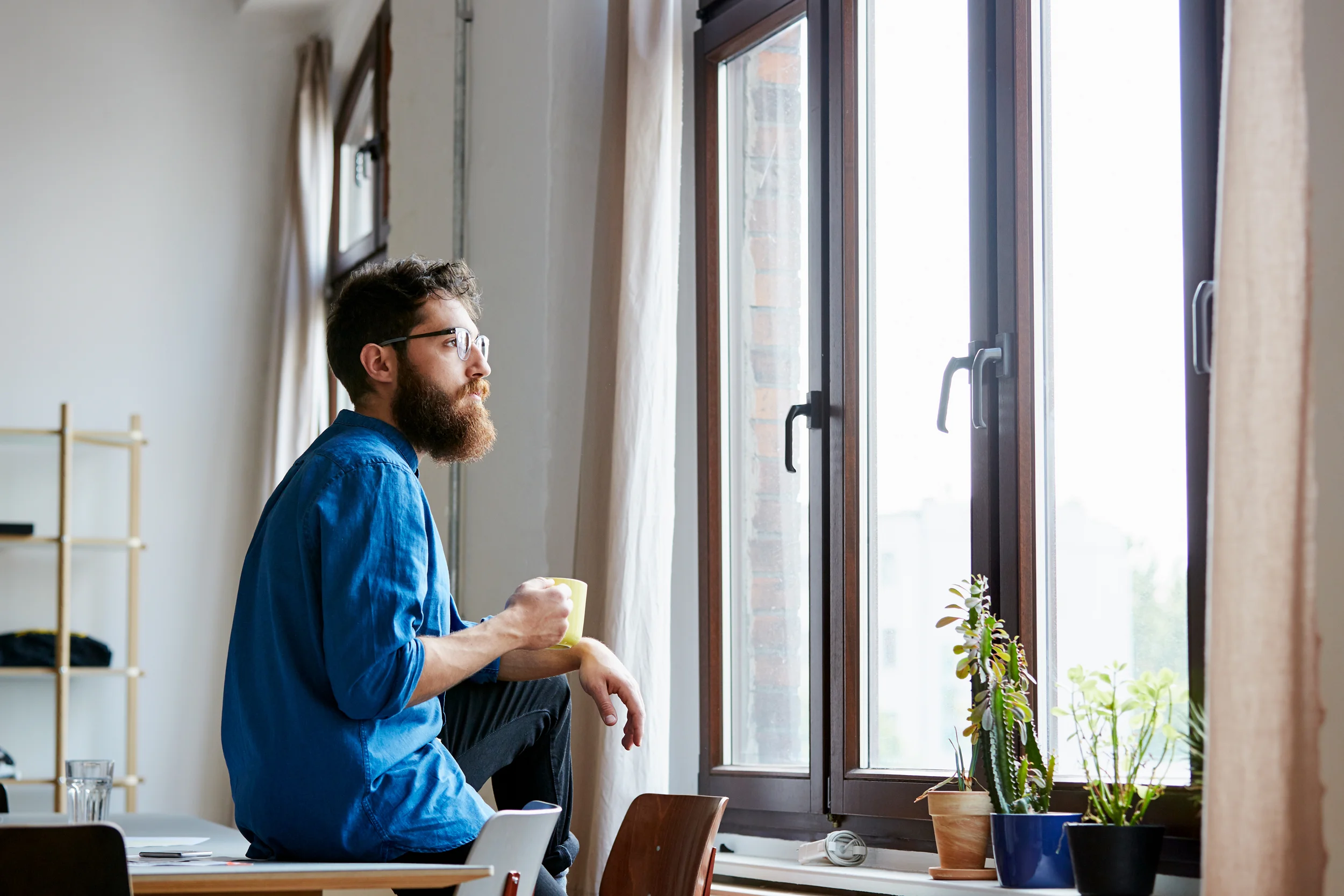 Design Professional Looking Through The Window in Studio
