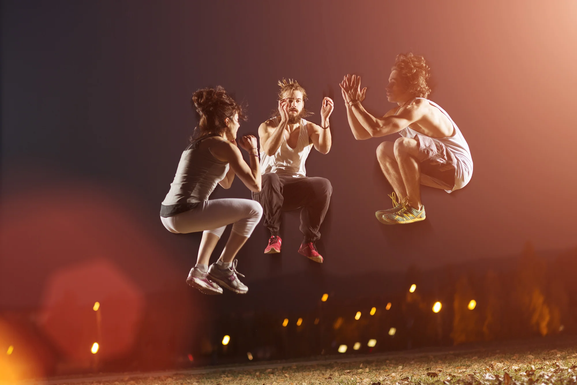 Portrait of Sports Team Doing Exercise at Night