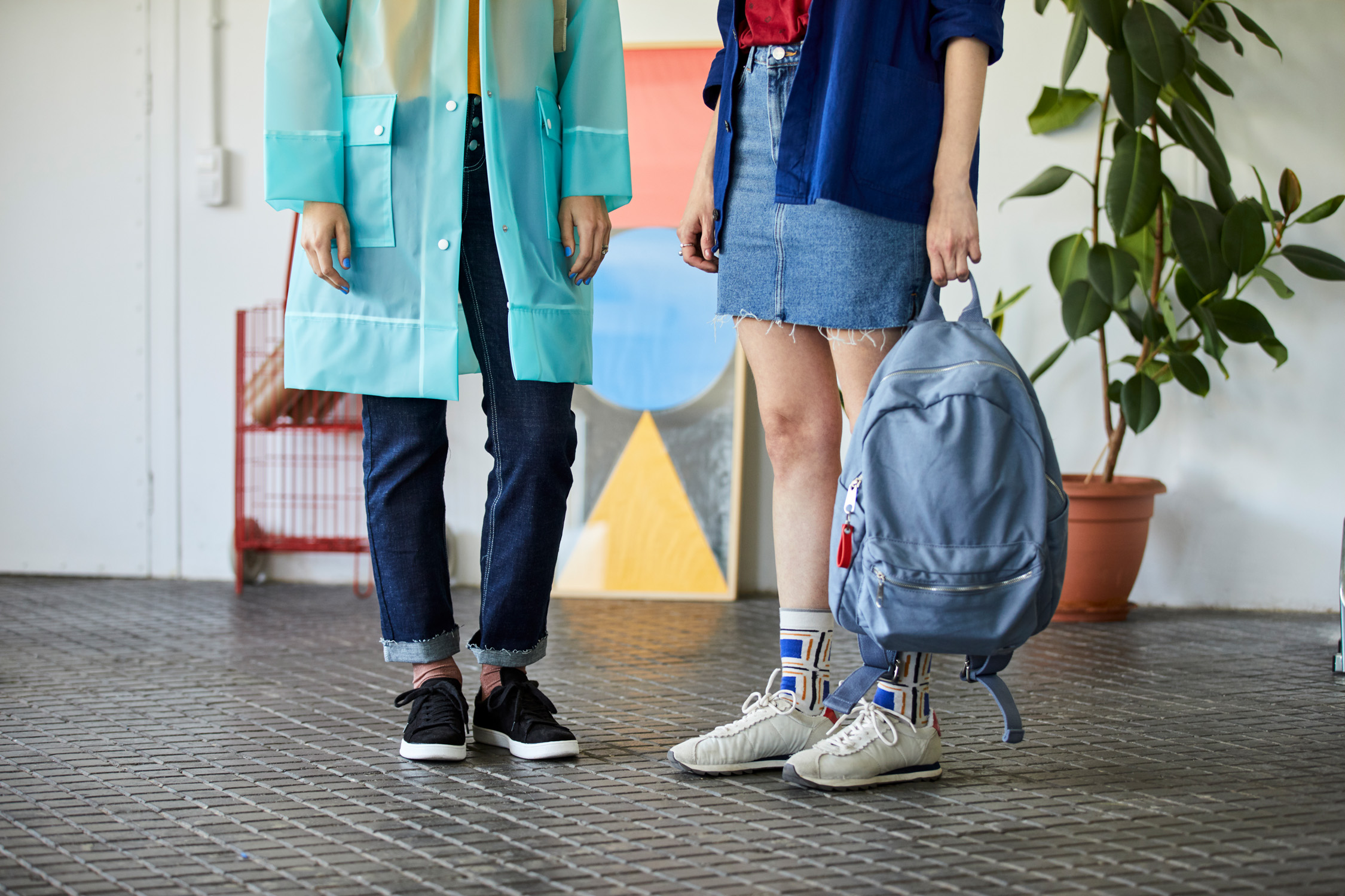 Low Section Of Businesswomen With Backpack