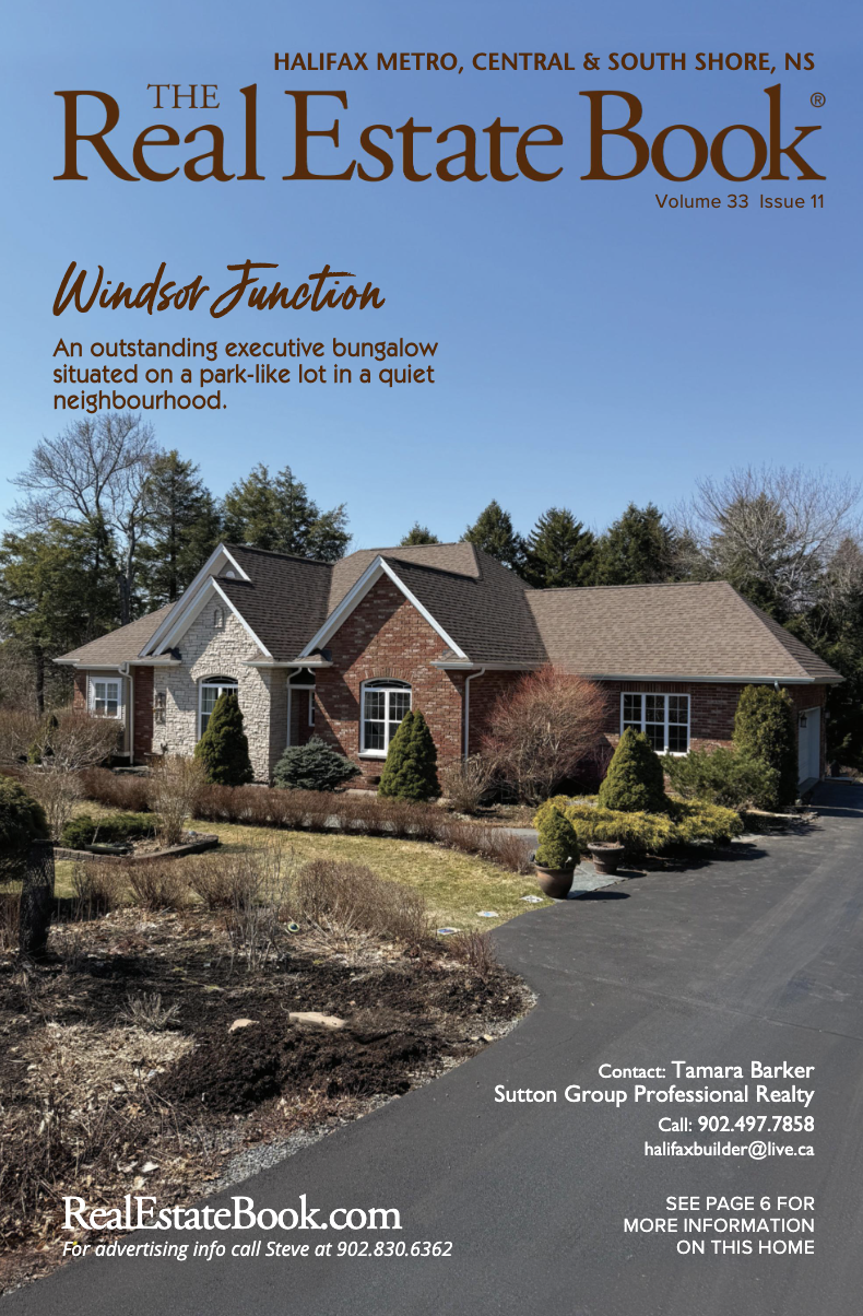 Front cover of a real estate magazine with a bungalow on it.