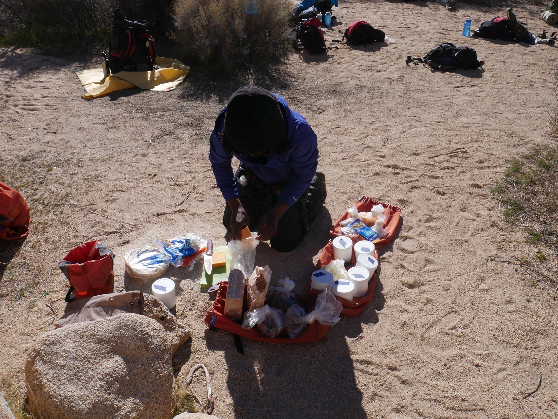 Felistus, assembling lunch for the rest of the backpacking group.