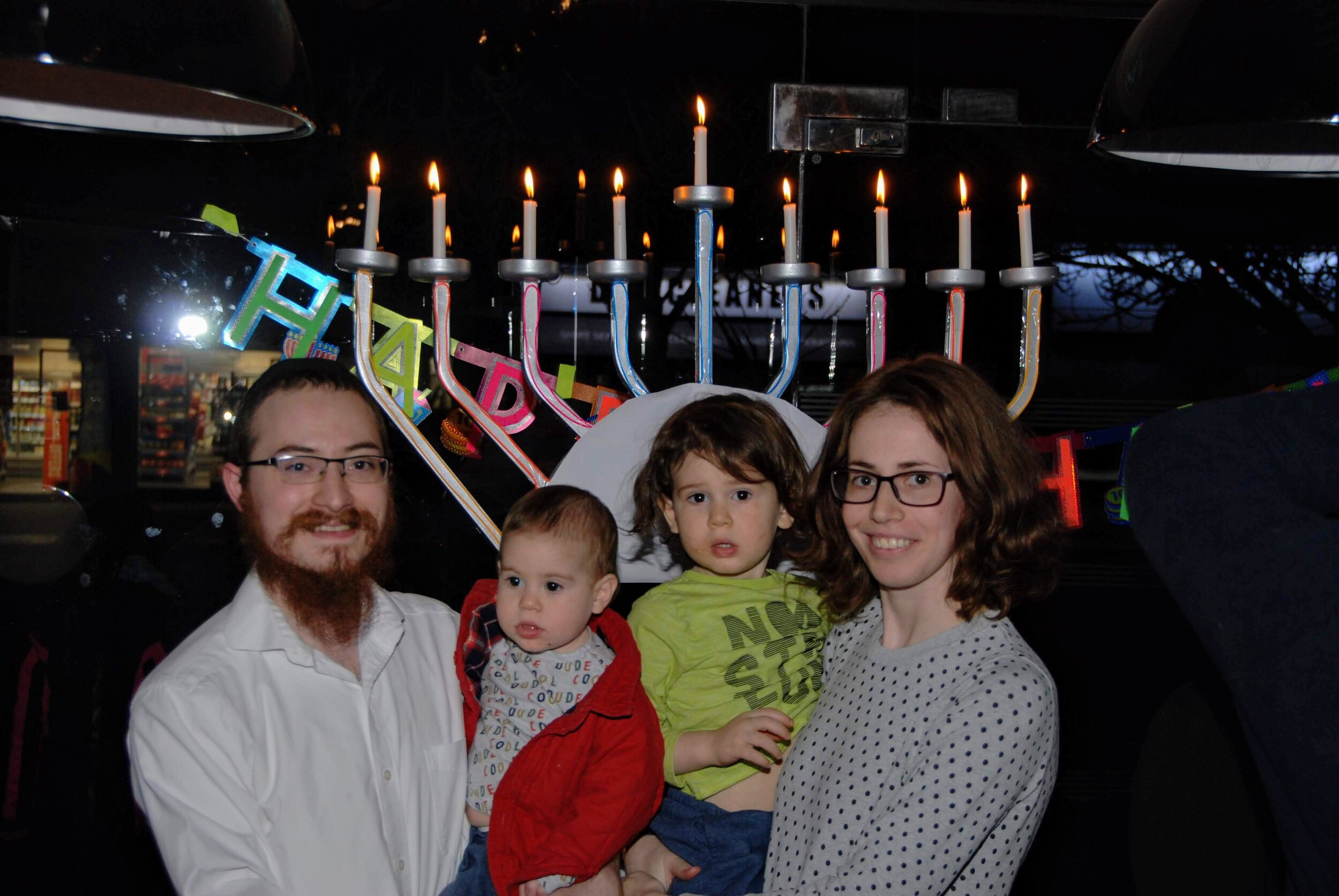 Rabbi Yosef and Goldie Sharfstein From Bushey Chabad Pose in Front of Bushey's First High Street Menorah.JPG