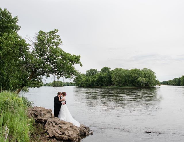 There are no sweeter words to hear than yes when you ask your bride if she is game to scale down the river&rsquo;s edge and balance on some rocks for a photo. I even gave her my shoes😜I think we can all agree it was SO WORTH IT. #minneapoliswedding 