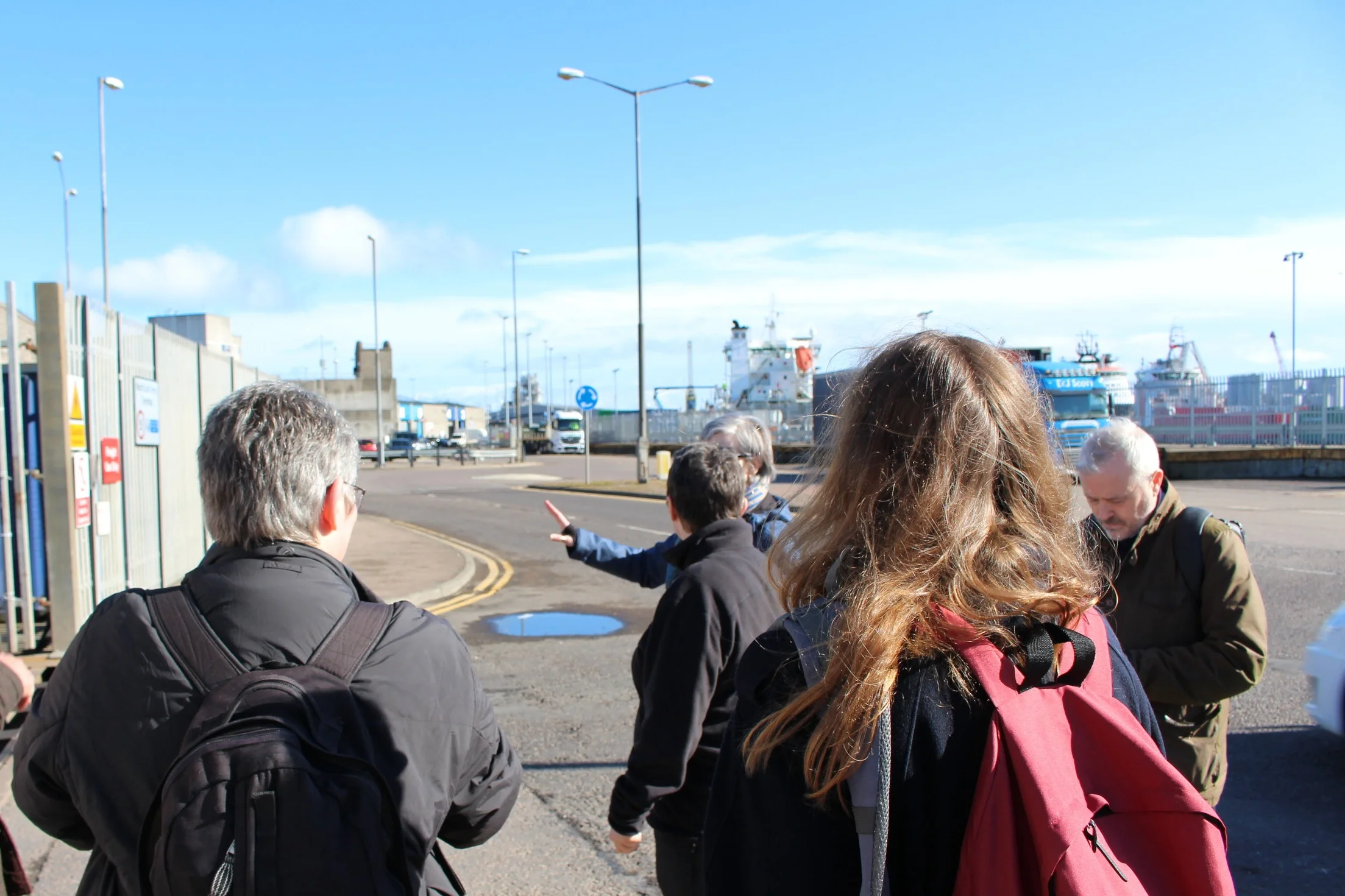 Description: The group considers a road crossing and surfaces on the way to the harbour.