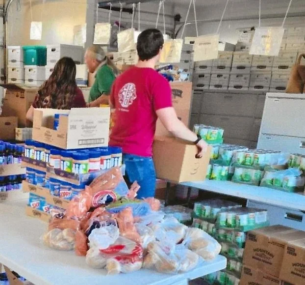 El Cajon Valley Host Lions Club loaded up six pickup trucks of groceries for their annual Christmas Food Baskets Program