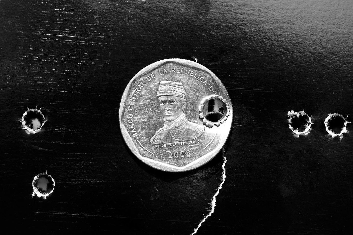  A Dominican coin shot by the M16 in a shooting range in San Salvador. 
