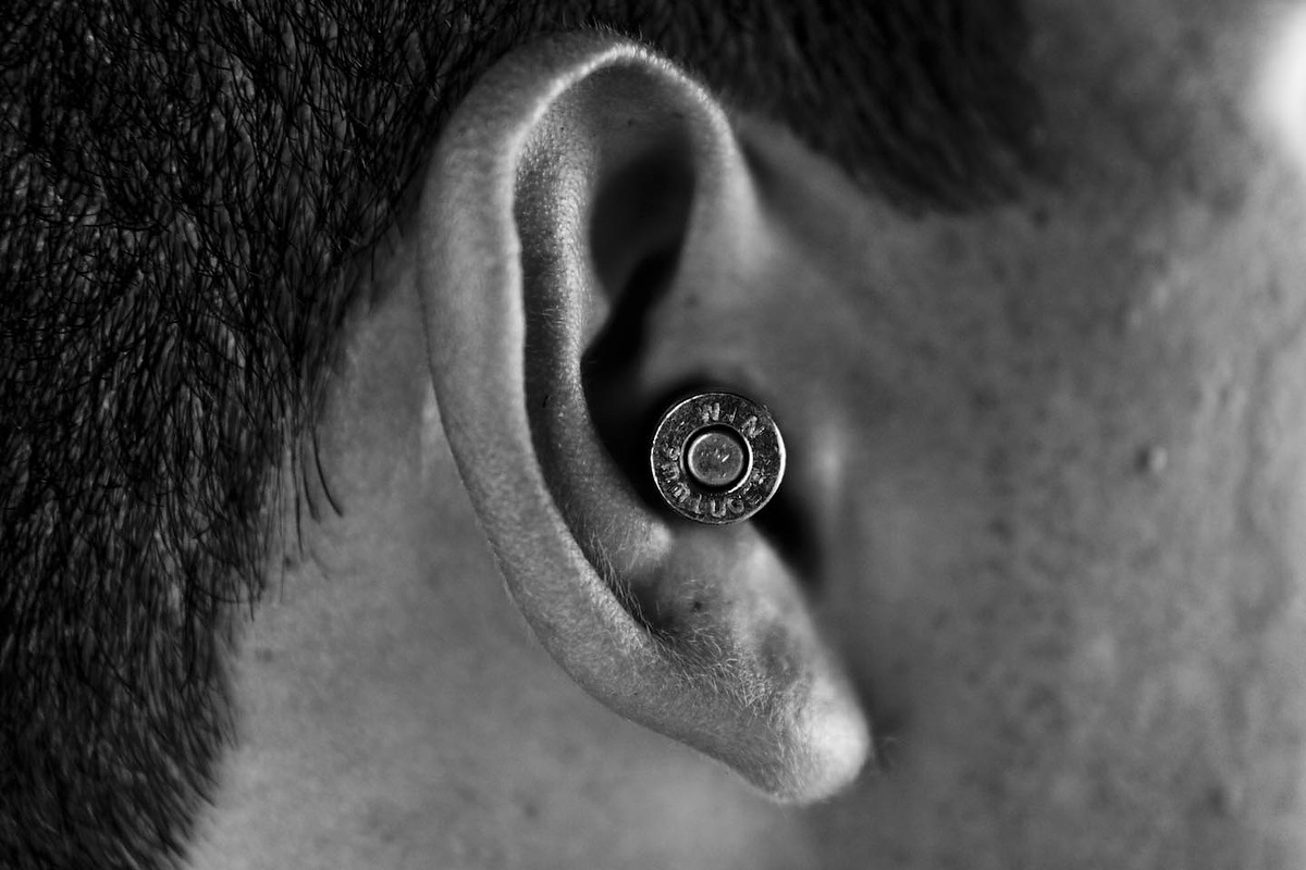  Bullets in ears to absorb the sound from the guns and avoid eardrum injuries. 