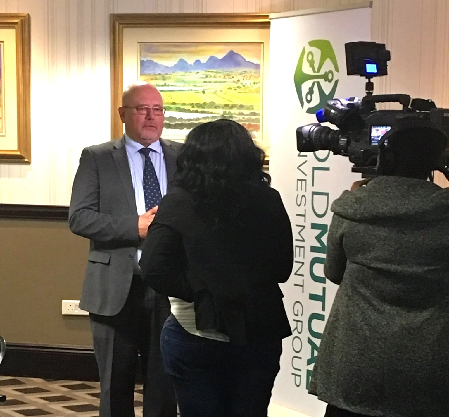 SABC 1 interviews an economist from Old Mutual Investment Group at their quarterly media briefings.
