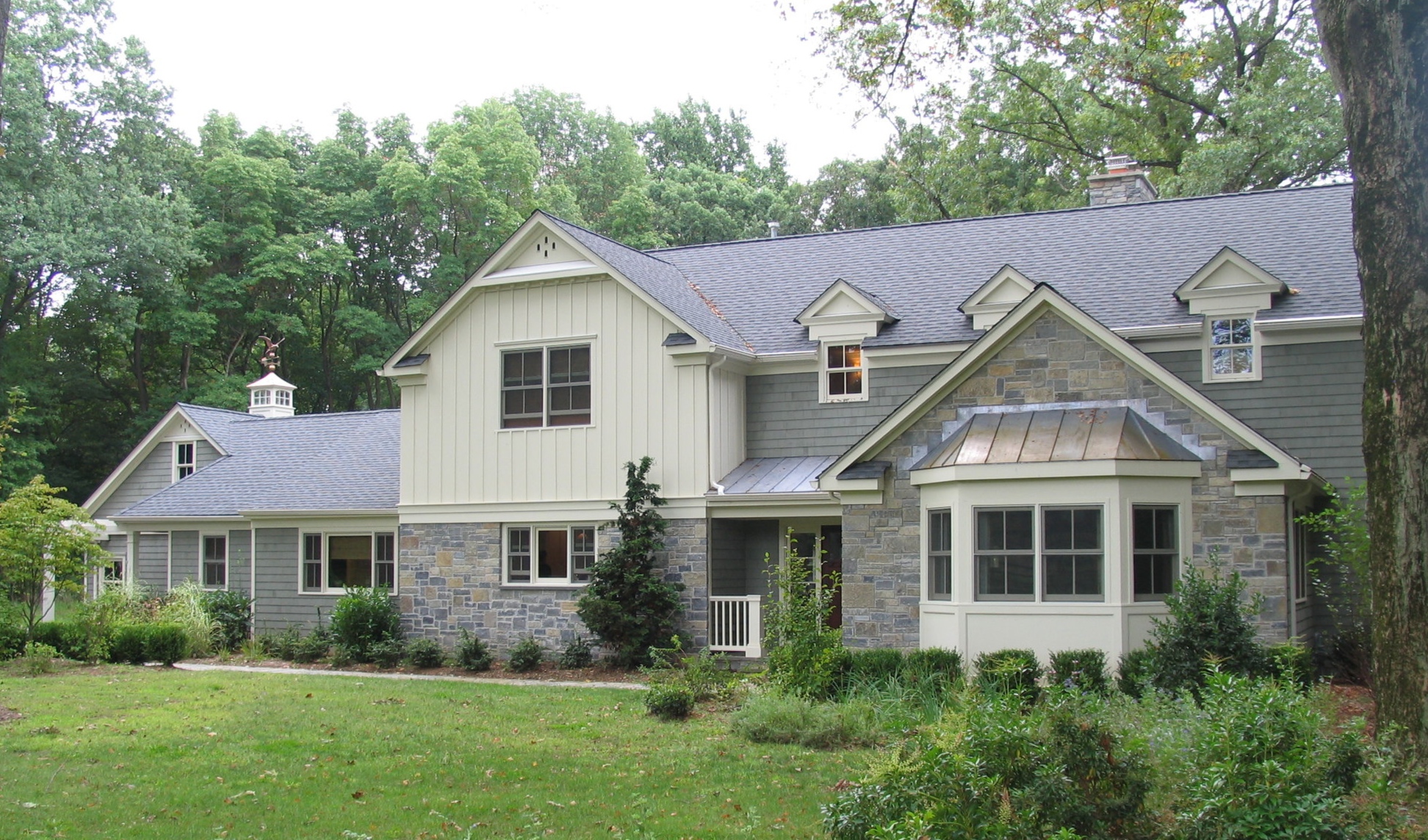 A new 4,000 sq. ft home with passive solar features. Clients wanted a floor plan that allowed separation from their three teenage children so plan was developed with master bedroom suite at first floor and kids rooms at the second with connecting st