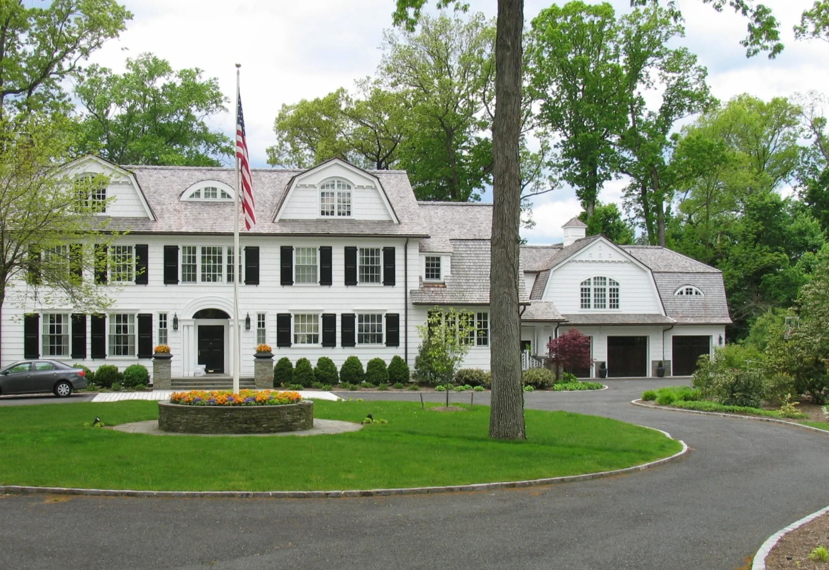  This was pretty much a total stylistic overall to a rather bland center hall house on a gorgeous piece of property. New additions include a 3 car garage and mudroom with full exercise and guest suite above, new main attic space featuring separate bo