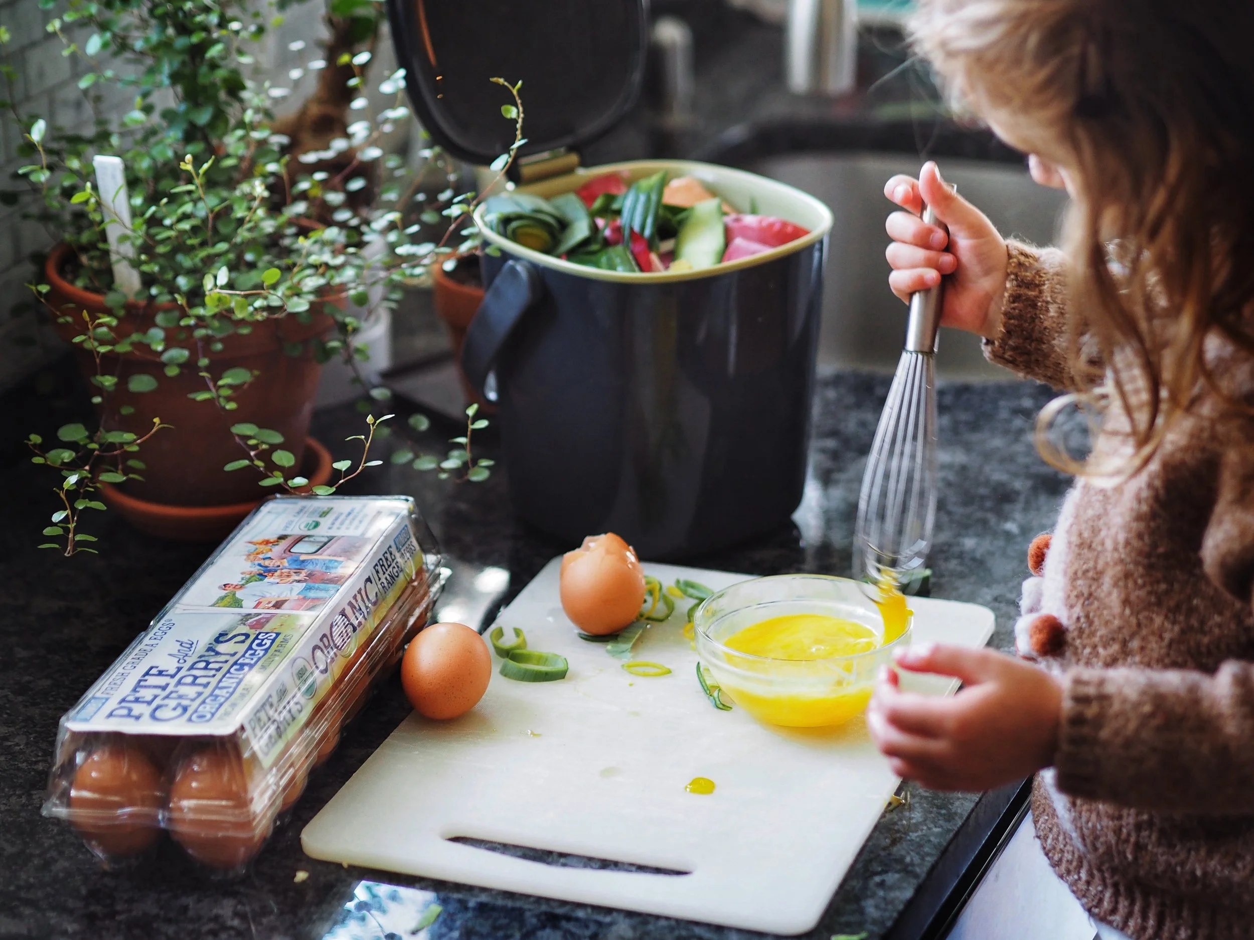 You can use composting as a teaching opportunity for kids! Luci loves gathering our “green” material to add to our bin, and I love seeing her grow more aware of nature’s processes and cycles.