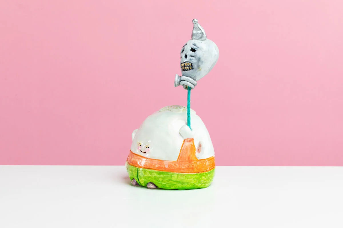 Surreal Humorous Original Hand-built Ceramic Sculpture of Evil Child with Balloon by Burlington-Based Ceramicist Jennifer McCandless