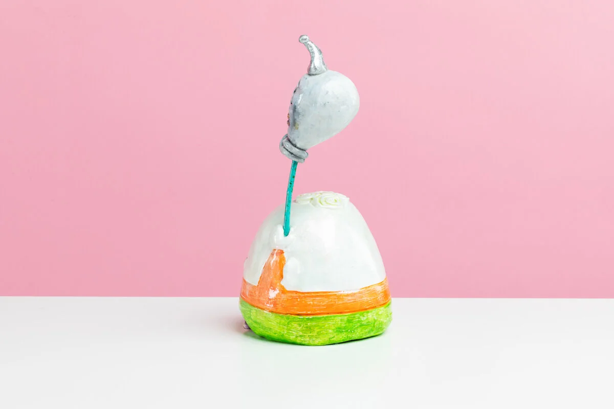 Surreal Humorous Original Hand-built Ceramic Sculpture of Evil Child with Balloon by Burlington-Based Ceramicist Jennifer McCandless