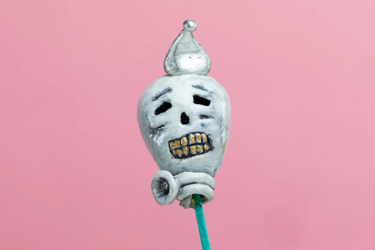 Surreal Humorous Original Hand-built Ceramic Sculpture of Evil Child with Balloon by Burlington-Based Ceramicist Jennifer McCandless