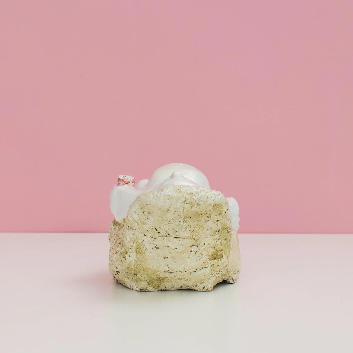 humorous hand built and painted ceramic sculpture of a ghost laying in an armchair with a can of soda  by Jennifer McCandless available through Soapbox Arts