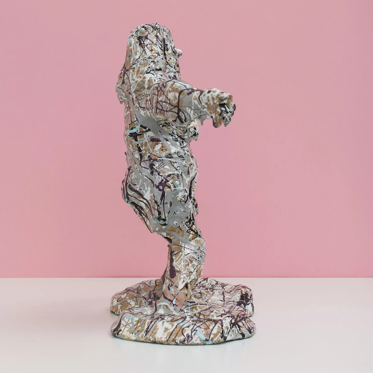 humorous hand built and painted ceramic sculpture of a female figure covered in Jackson Pollock-inspired splatter paint by Jennifer McCandless available through Soapbox Arts
