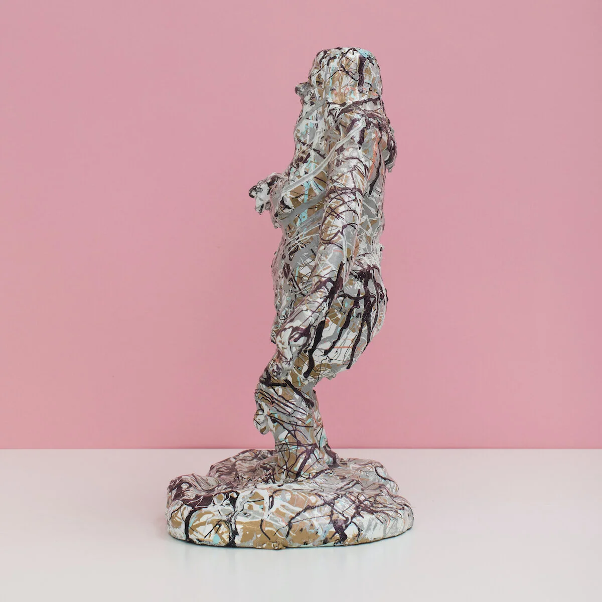 humorous hand built and painted ceramic sculpture of a female figure covered in Jackson Pollock-inspired splatter paint by Jennifer McCandless available through Soapbox Arts