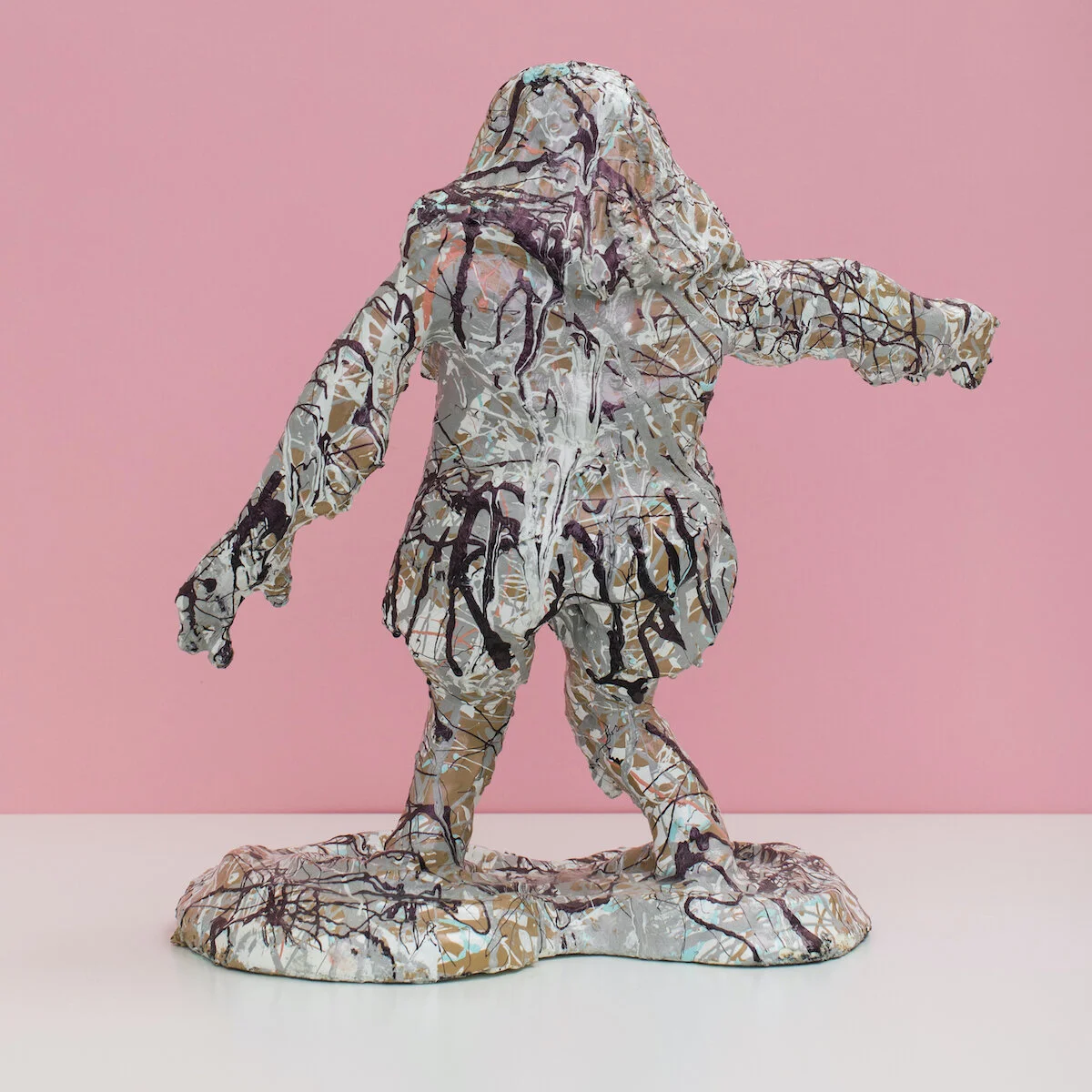 humorous hand built and painted ceramic sculpture of a female figure covered in Jackson Pollock-inspired splatter paint by Jennifer McCandless available through Soapbox Arts