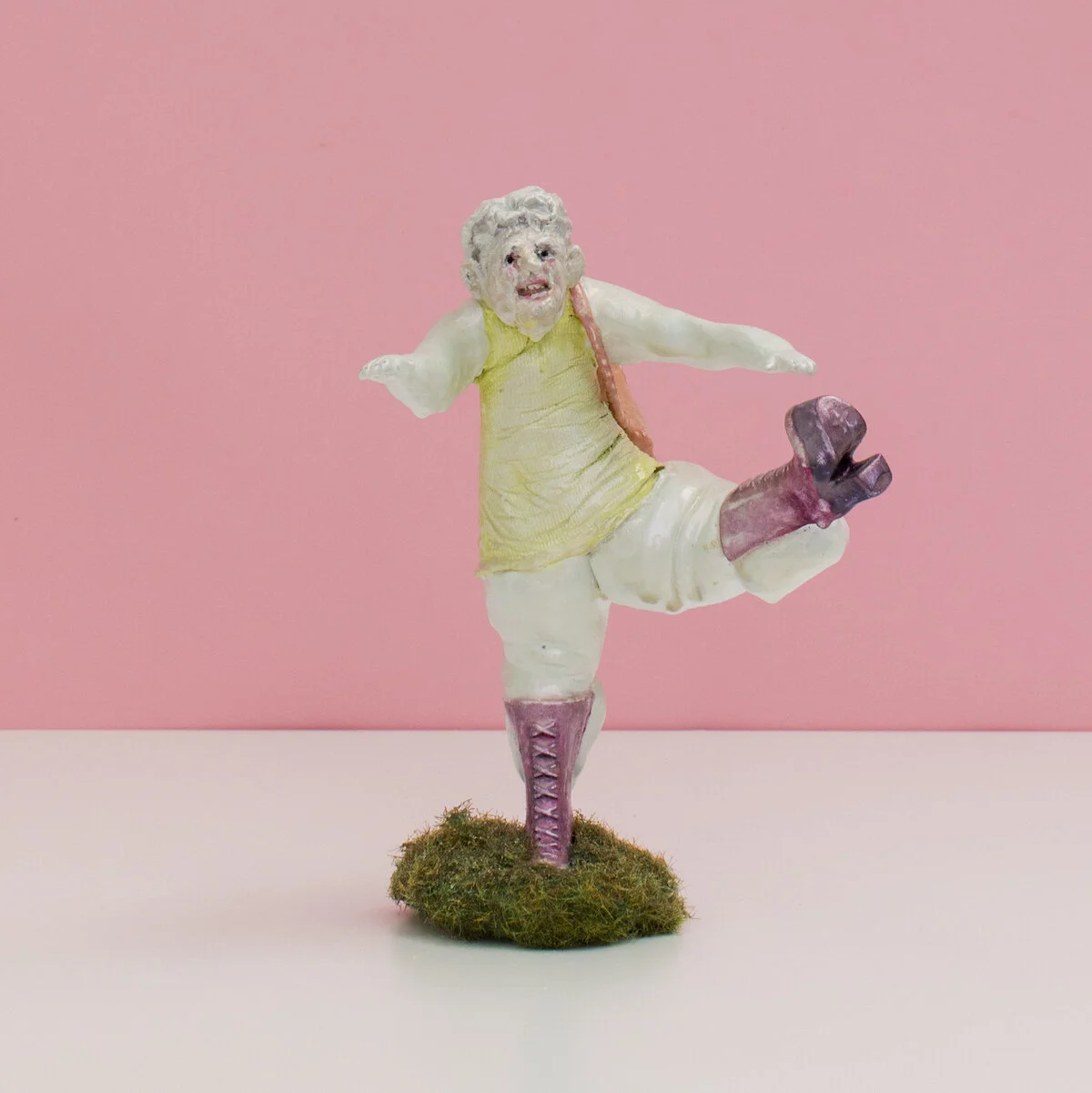 humorous hand built and painted ceramic sculptures of small women squeezing into tight fitting clothing in flailing positions by Jennifer McCandless available through Soapbox Arts