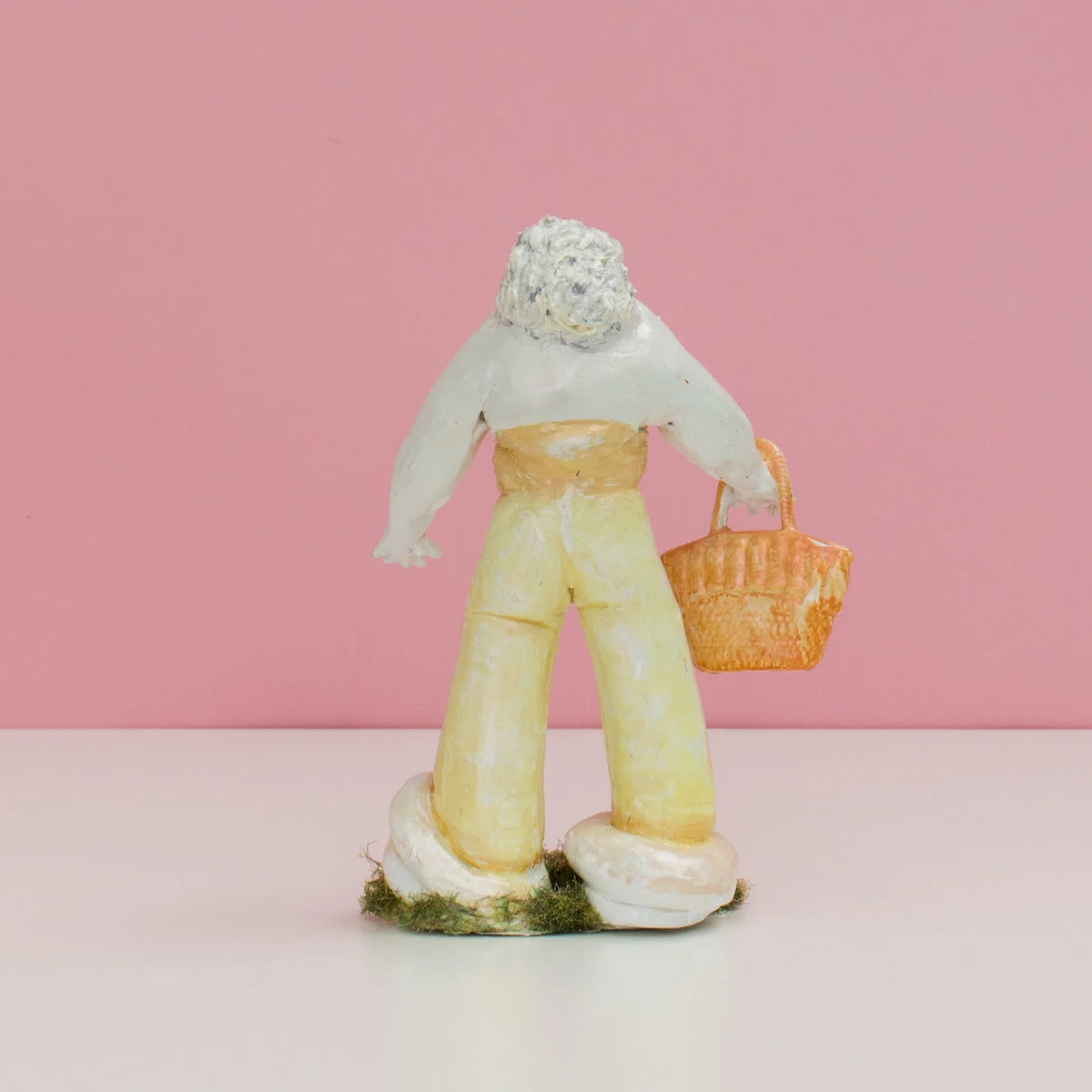 humorous hand built and painted ceramic sculptures of small women squeezing into tight fitting clothing in flailing positions by Jennifer McCandless available through Soapbox Arts