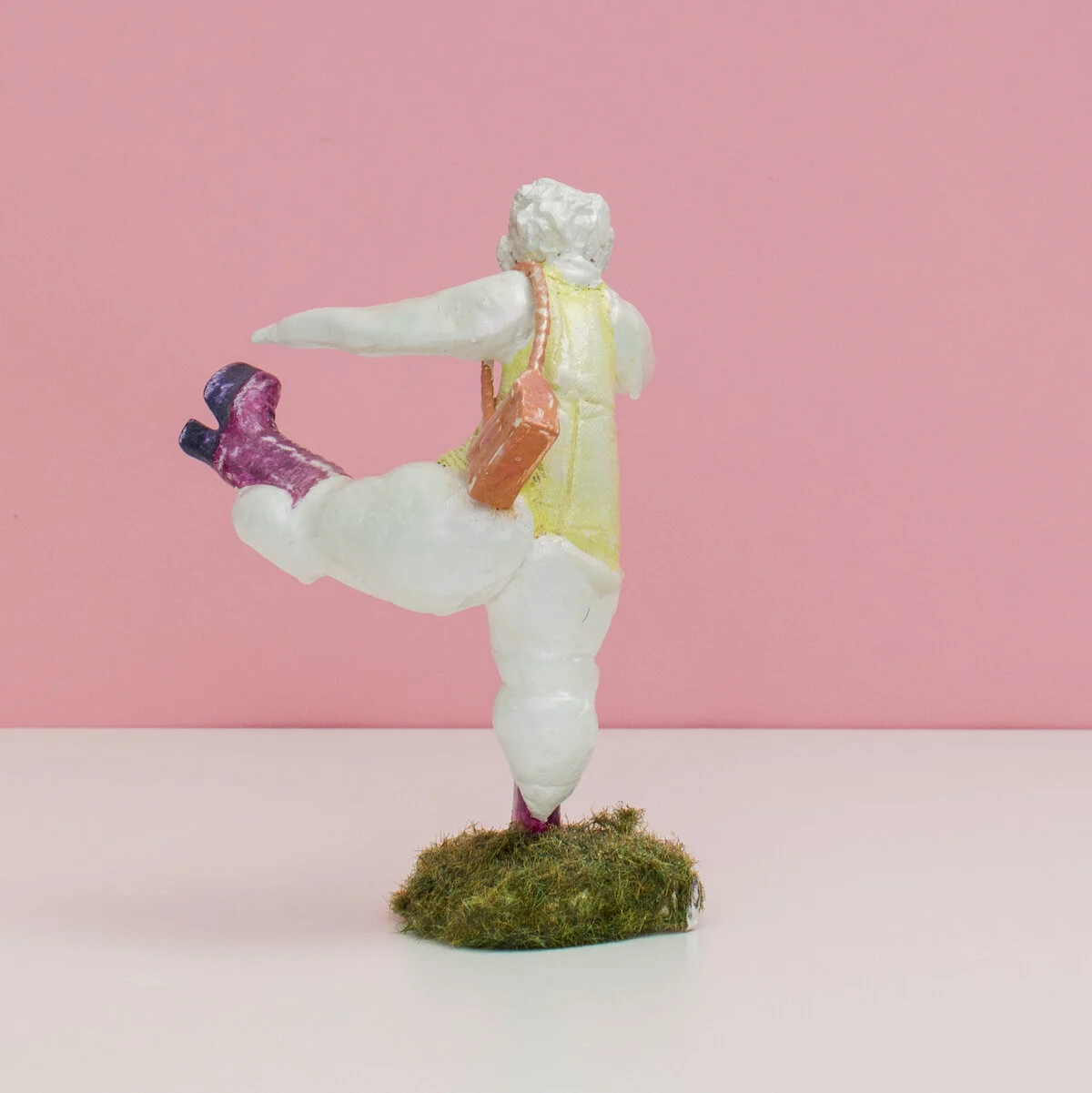 humorous hand built and painted ceramic sculptures of small women squeezing into tight fitting clothing in flailing positions by Jennifer McCandless available through Soapbox Arts