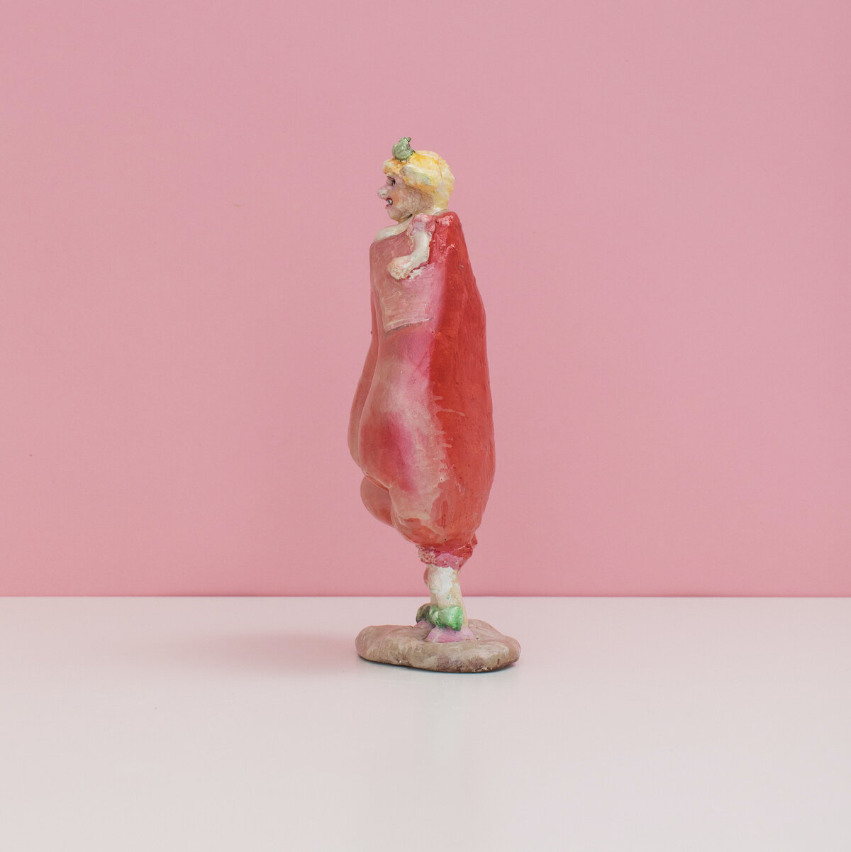 humorous hand built and painted ceramic sculpture of a female figure with a boxing glove creating her hips by Jennifer McCandless available through Soapbox Arts