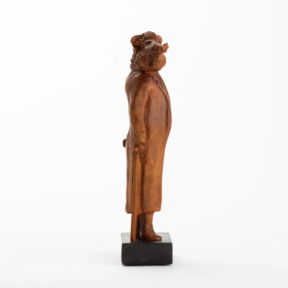 Original anthropomorphic wood sculpture on a stone base of a boar in jacket with a cane by Vermont artist and sculptor, Joe Lupiani, available @ Soapbox Arts Gallery in Vermont