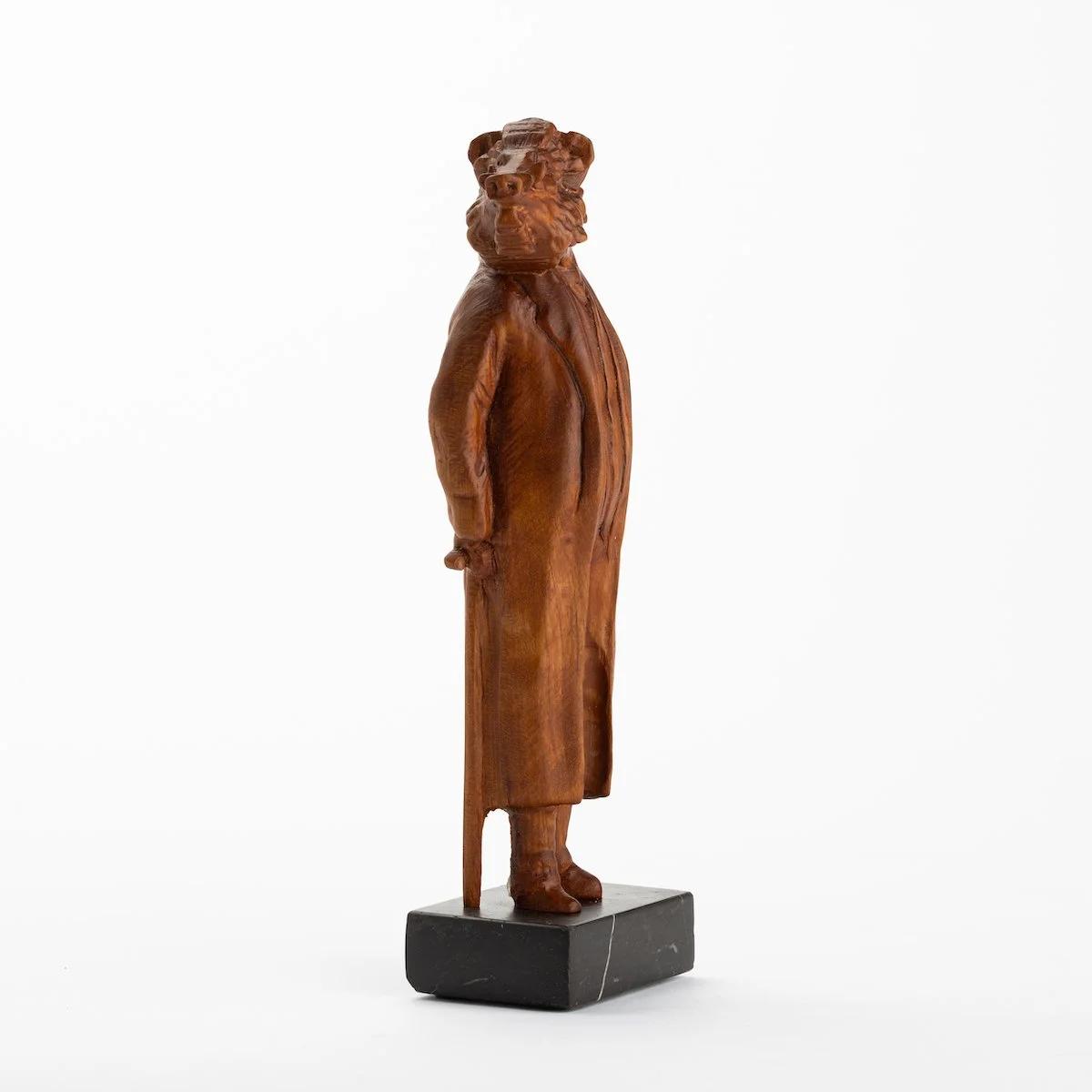 Original anthropomorphic wood sculpture on a stone base of a boar in jacket with a cane by Vermont artist and sculptor, Joe Lupiani, available @ Soapbox Arts Gallery in Vermont