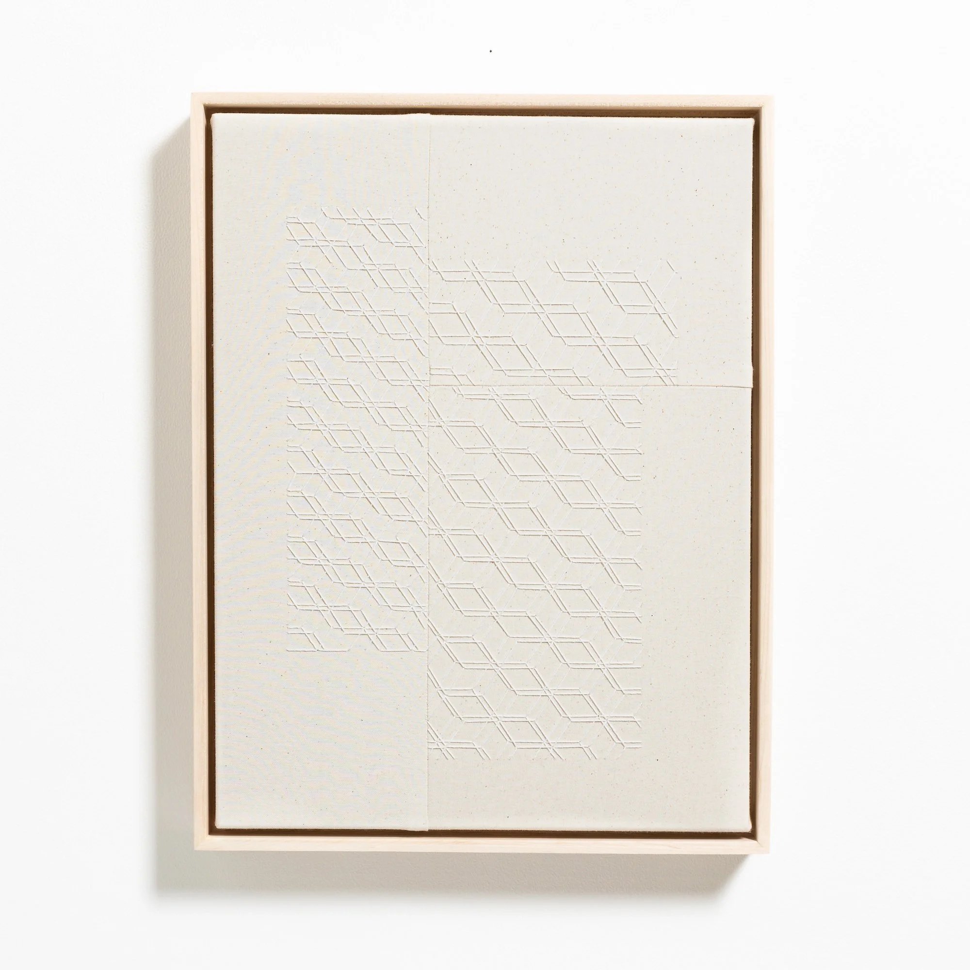 hand embroidered artwork with white thread on cotton canvas in geometric patterns by Alice Wiese for Soapbox Arts Gallery in Burlington, Vermont