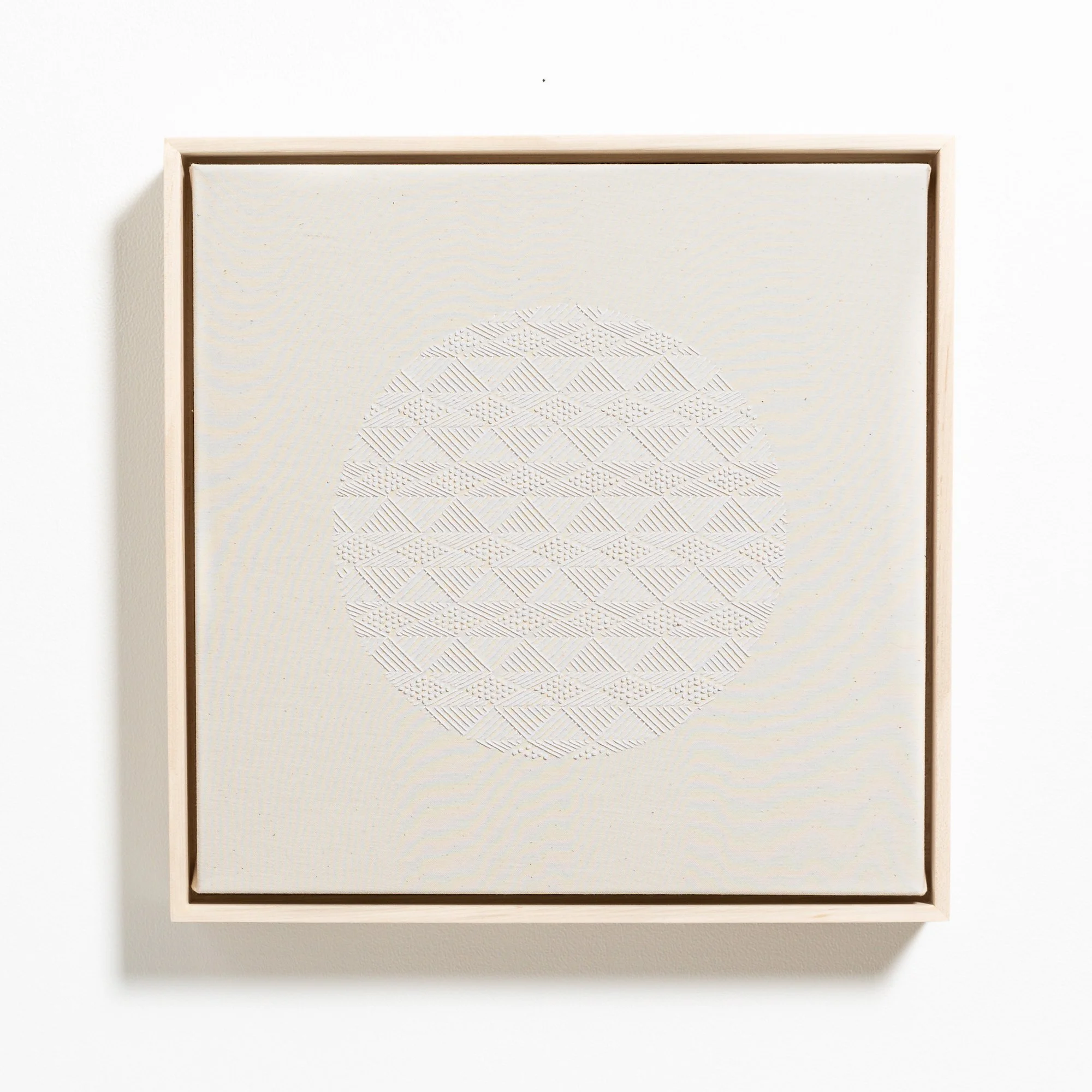 hand embroidered artwork with white thread on cotton canvas in geometric patterns by Alice Wiese for Soapbox Arts Gallery in Burlington, Vermont