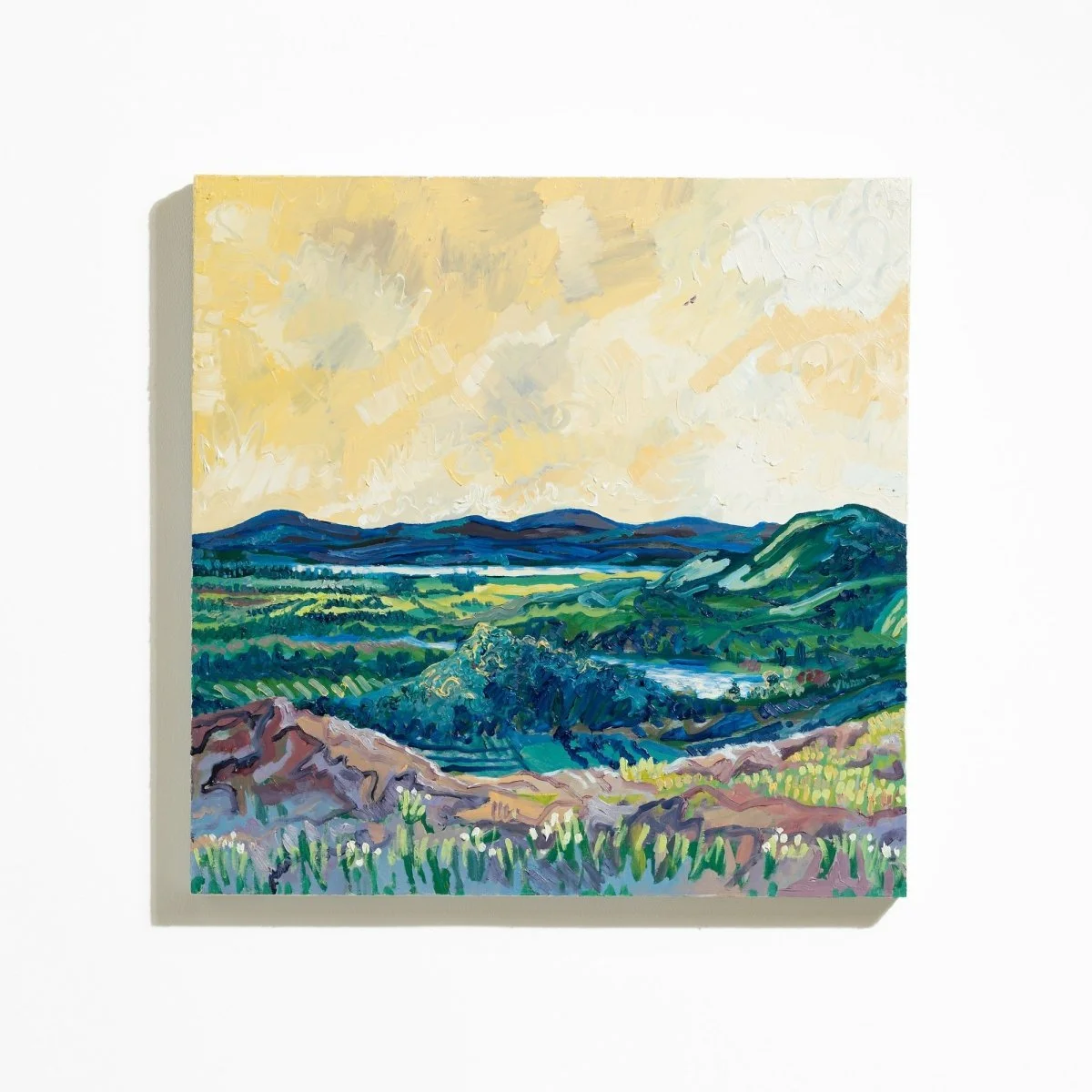Textured landscape painting in acrylic and oil of green hills and yellow sky by Charlie Hudson @ Soapbox Arts Gallery in Burlington, VT