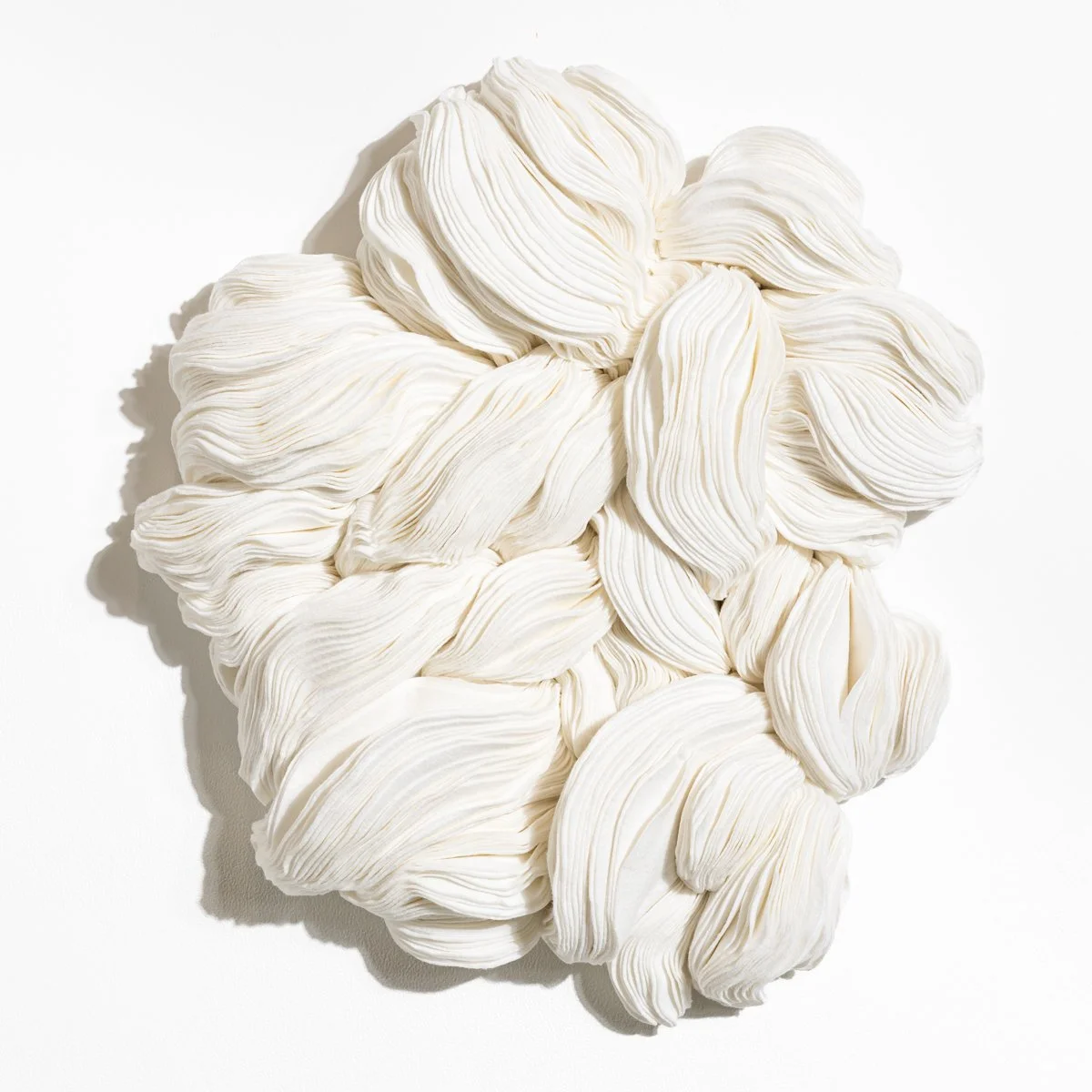 natural fabric textile wall sculpture in organic shapes by Sienna Marts @ Soapbox Arts Gallery in Burlington, Vermont