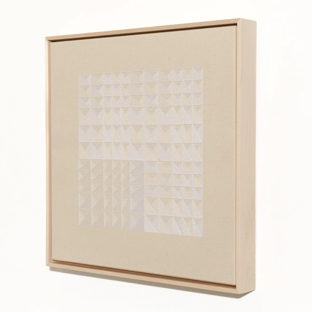 hand embroidered artwork with white thread on cotton canvas in geometric patterns by Alice Wiese for Soapbox Arts Gallery in Burlington, Vermont