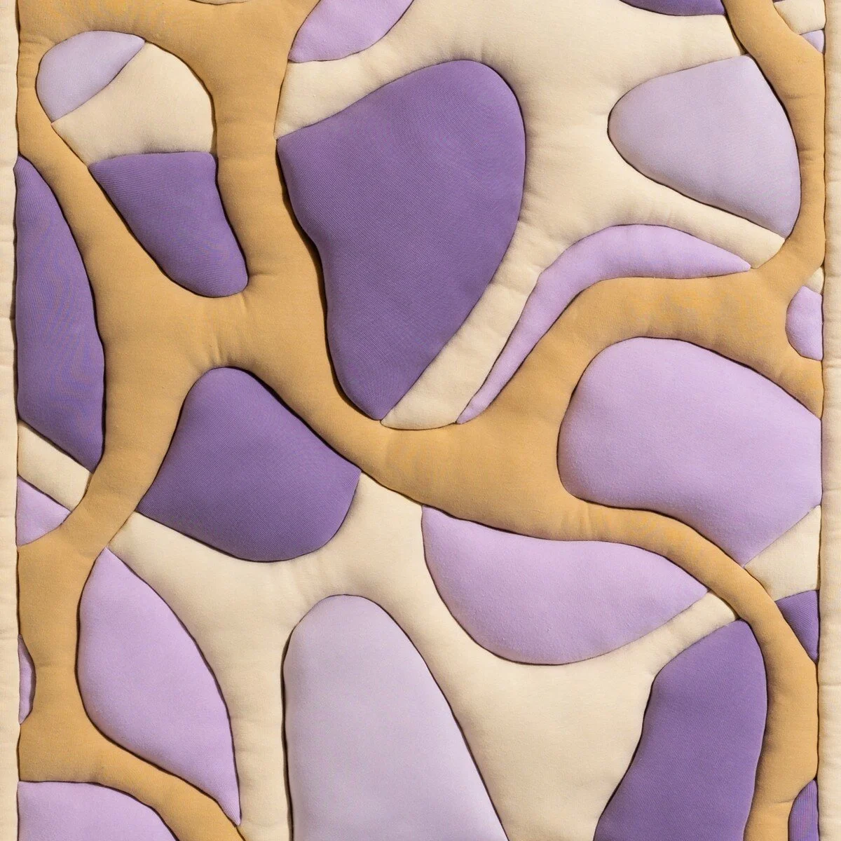natural fabric textile wall sculpture in organic shapes by Sienna Marts @ Soapbox Arts Gallery in Burlington, Vermont