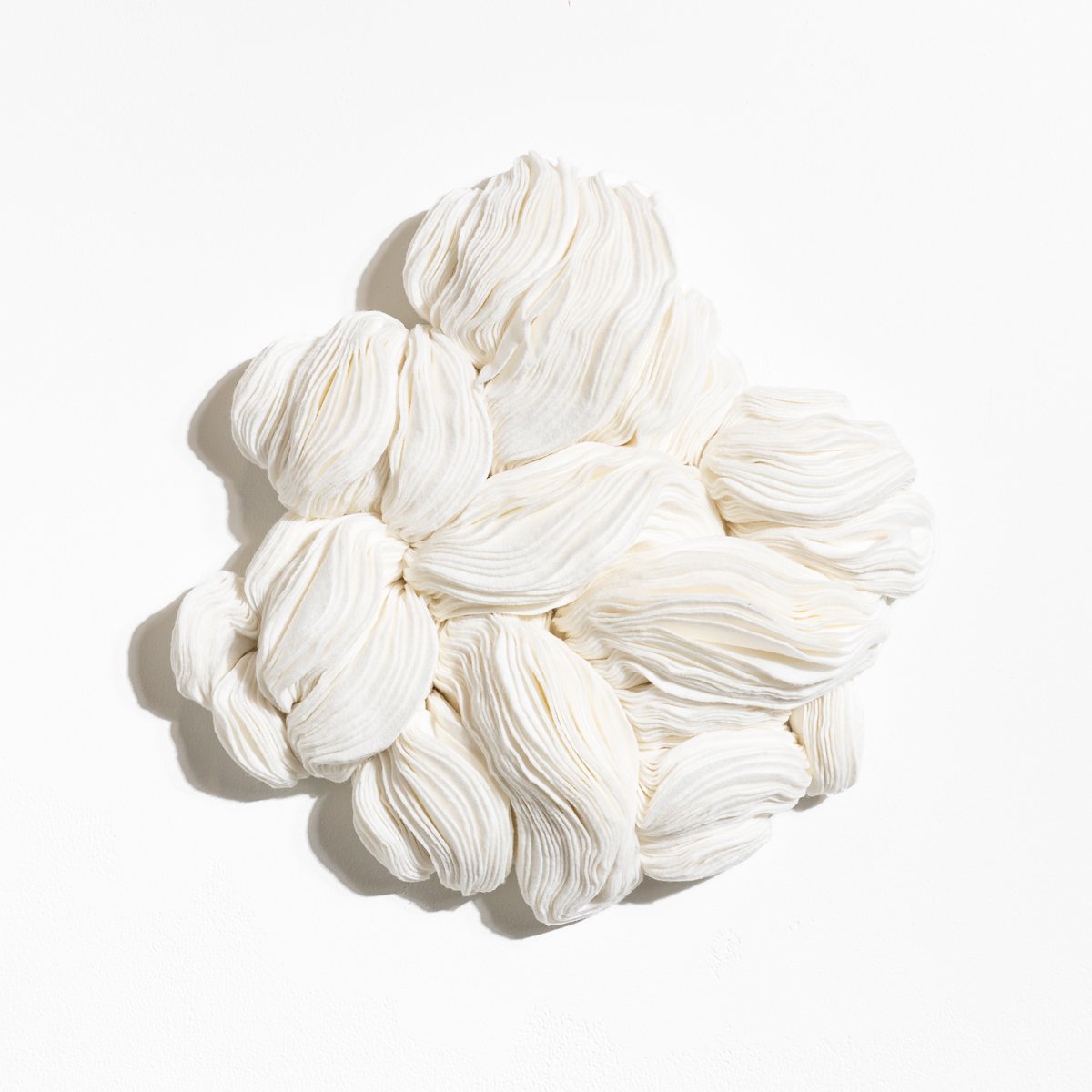 natural fabric textile wall sculpture in organic shapes by Sienna Marts @ Soapbox Arts Gallery in Burlington, Vermont