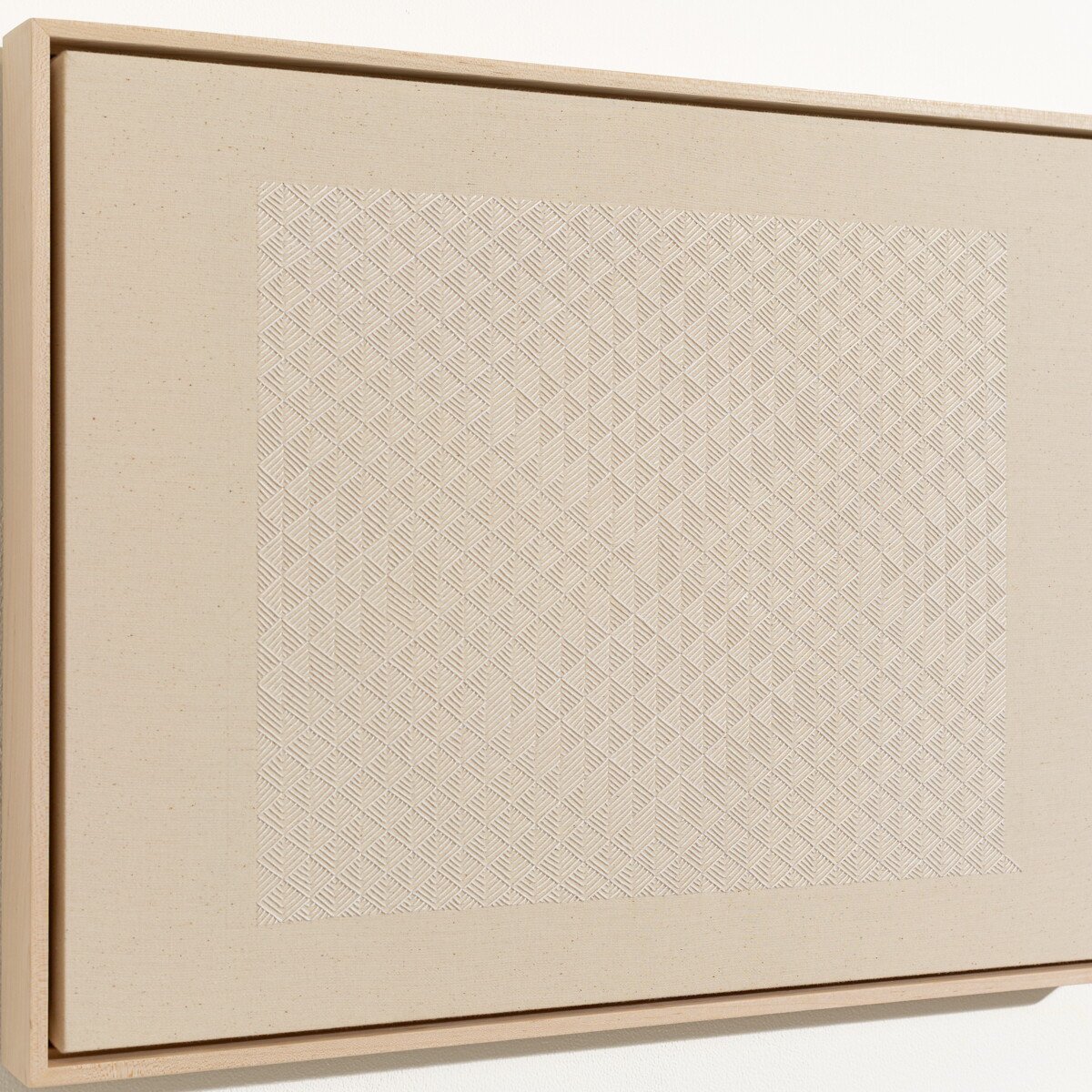 hand embroidered artwork with white thread on cotton canvas in geometric patterns by Alice Wiese for Soapbox Arts Gallery in Burlington, Vermont