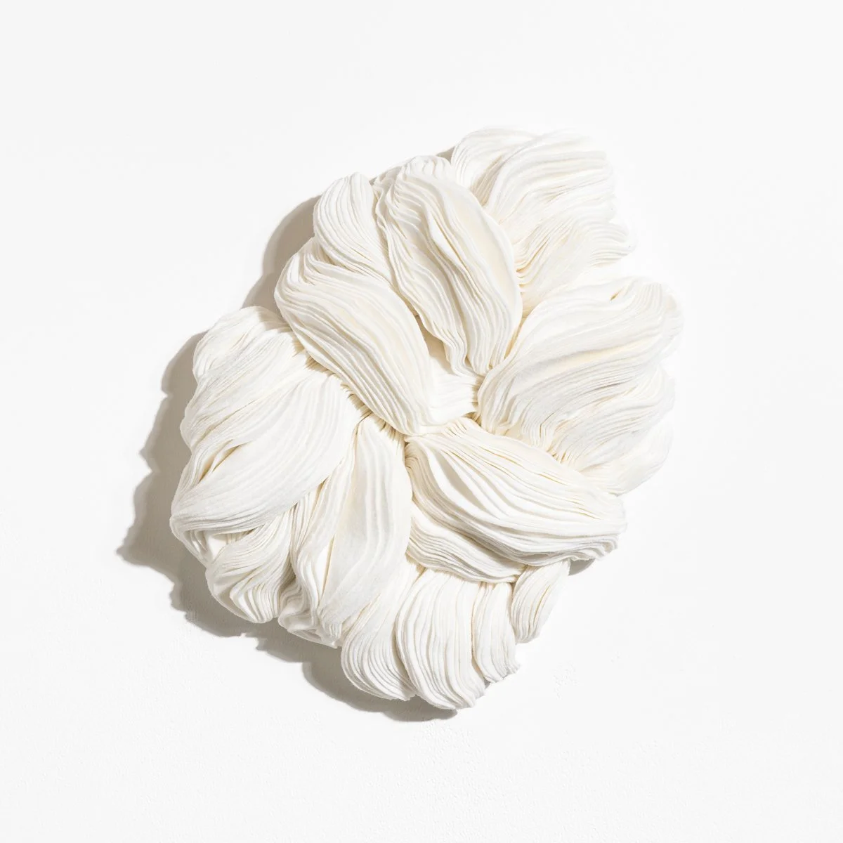 natural fabric textile wall sculpture in organic shapes by Sienna Marts @ Soapbox Arts Gallery in Burlington, Vermont