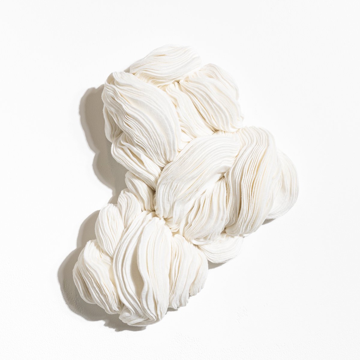 natural fabric textile wall sculpture in organic shapes by Sienna Marts @ Soapbox Arts Gallery in Burlington, Vermont