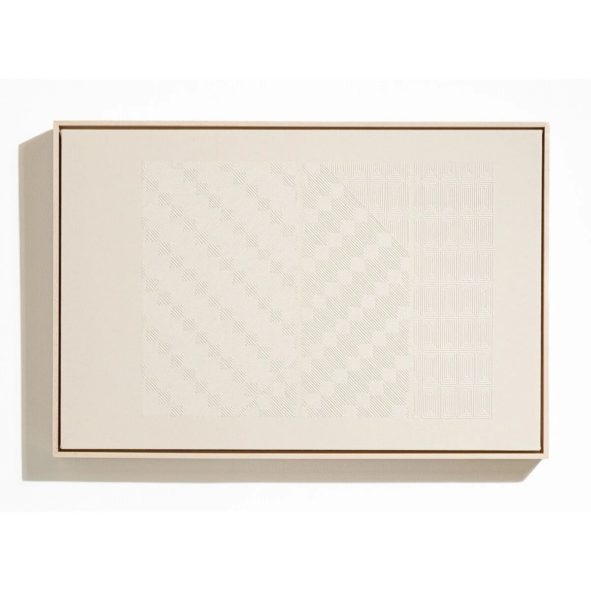 hand embroidered artwork with white thread on cotton canvas in geometric patterns by Alice Wiese for Soapbox Arts Gallery in Burlington, Vermont