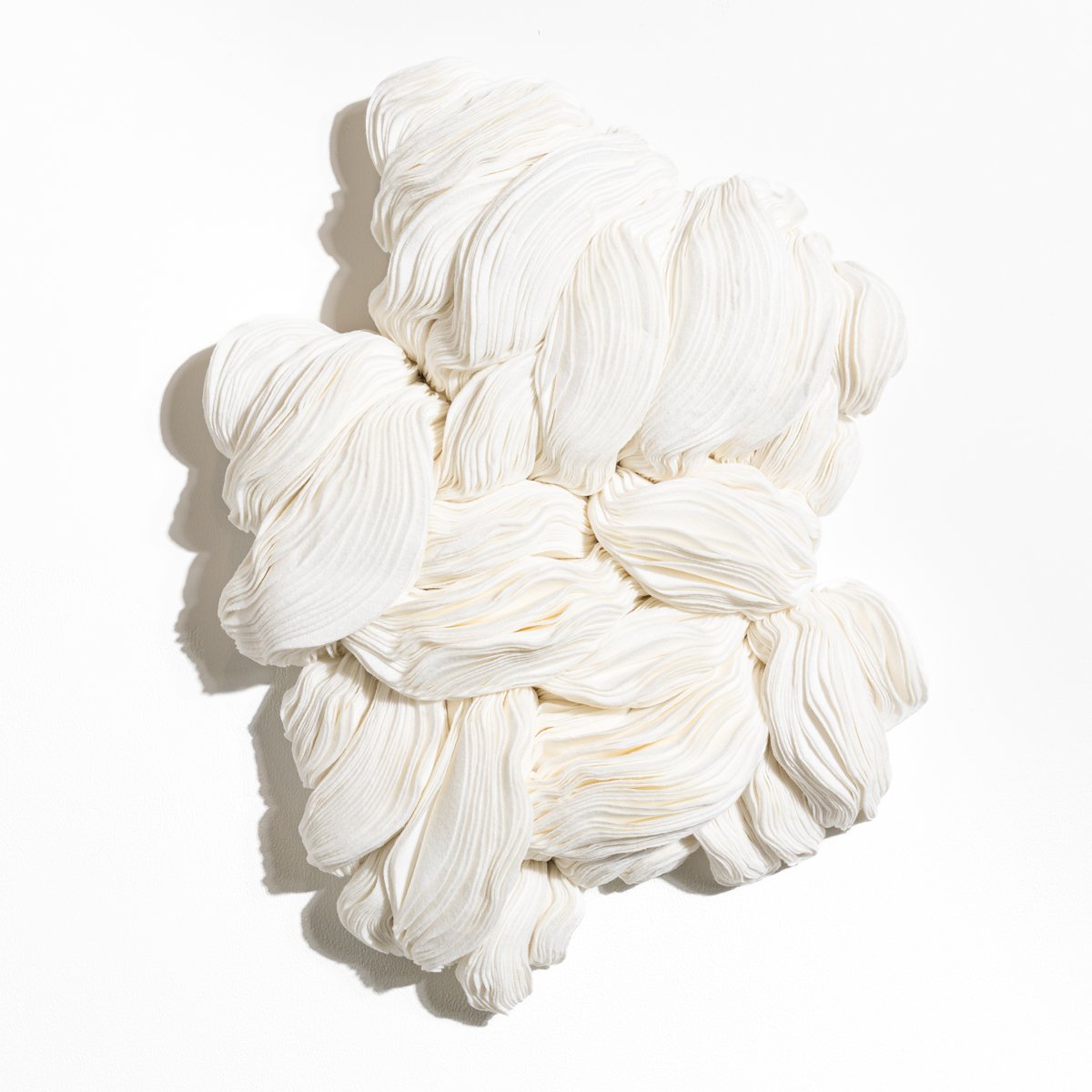 natural fabric textile wall sculpture in organic shapes by Sienna Marts @ Soapbox Arts Gallery in Burlington, Vermont