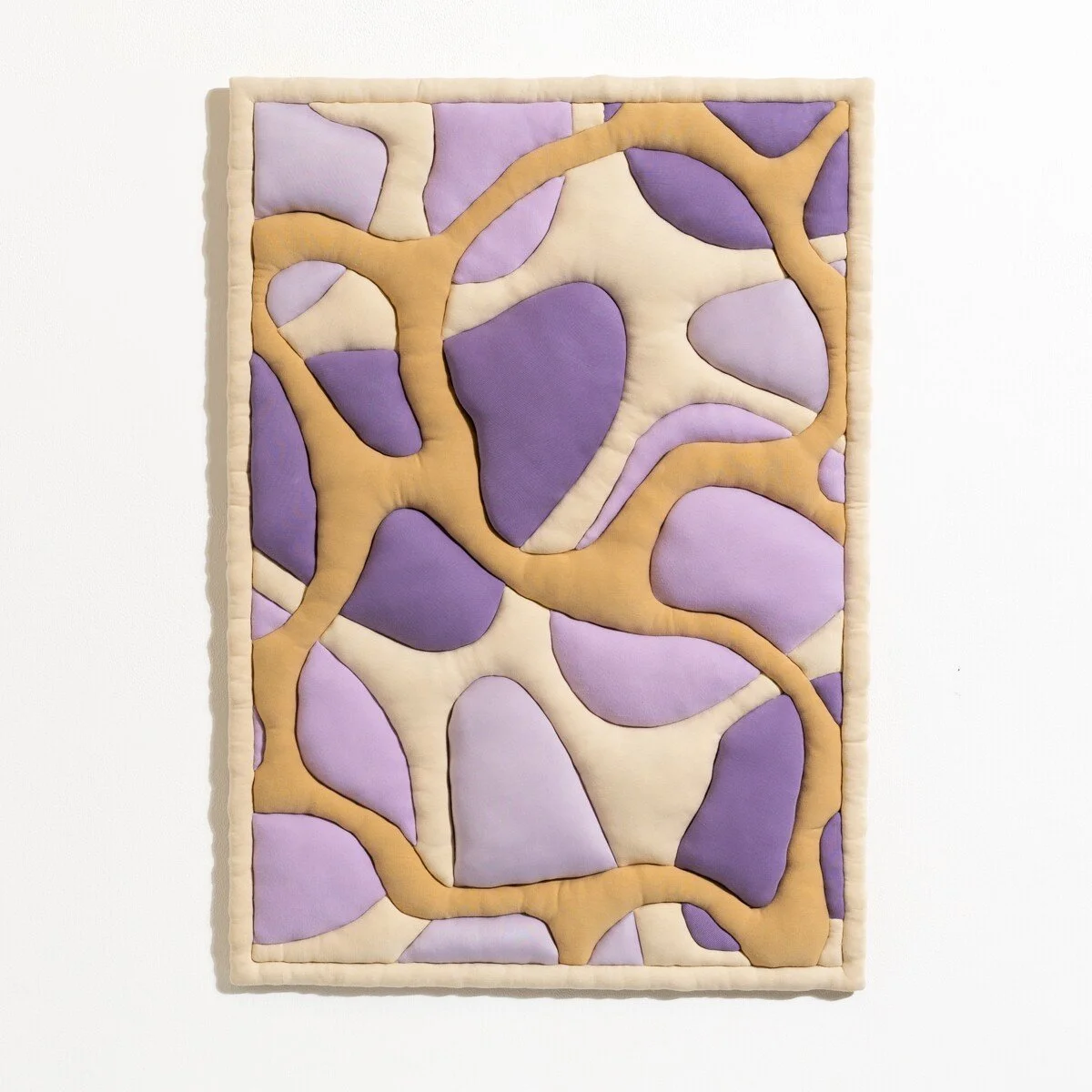 natural fabric textile wall sculpture in organic shapes by Sienna Marts @ Soapbox Arts Gallery in Burlington, Vermont