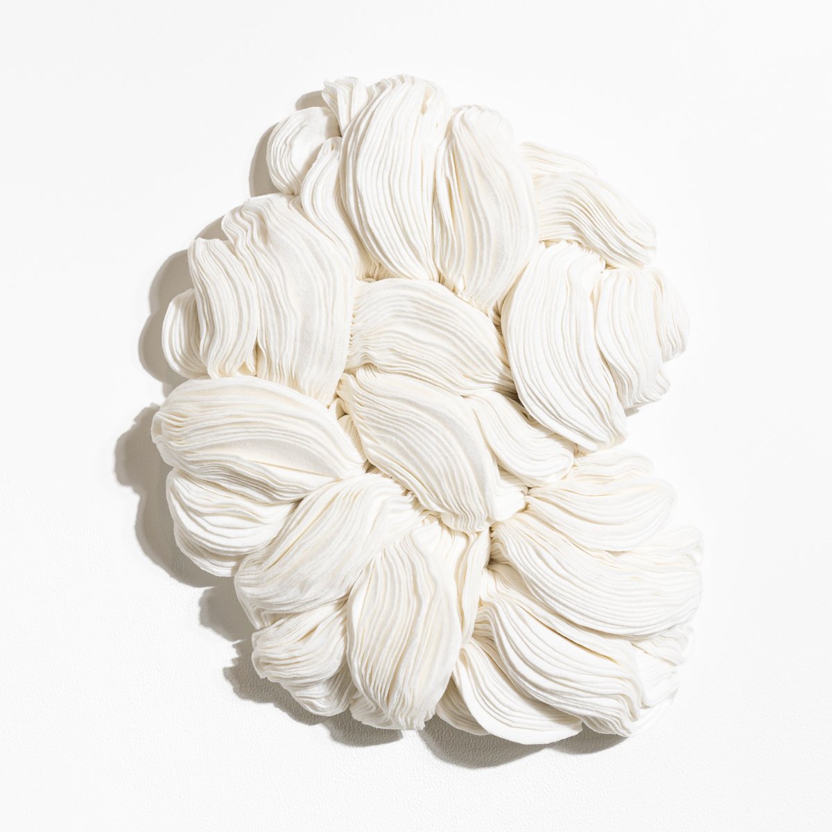 natural fabric textile wall sculpture in organic shapes by Sienna Marts @ Soapbox Arts Gallery in Burlington, Vermont