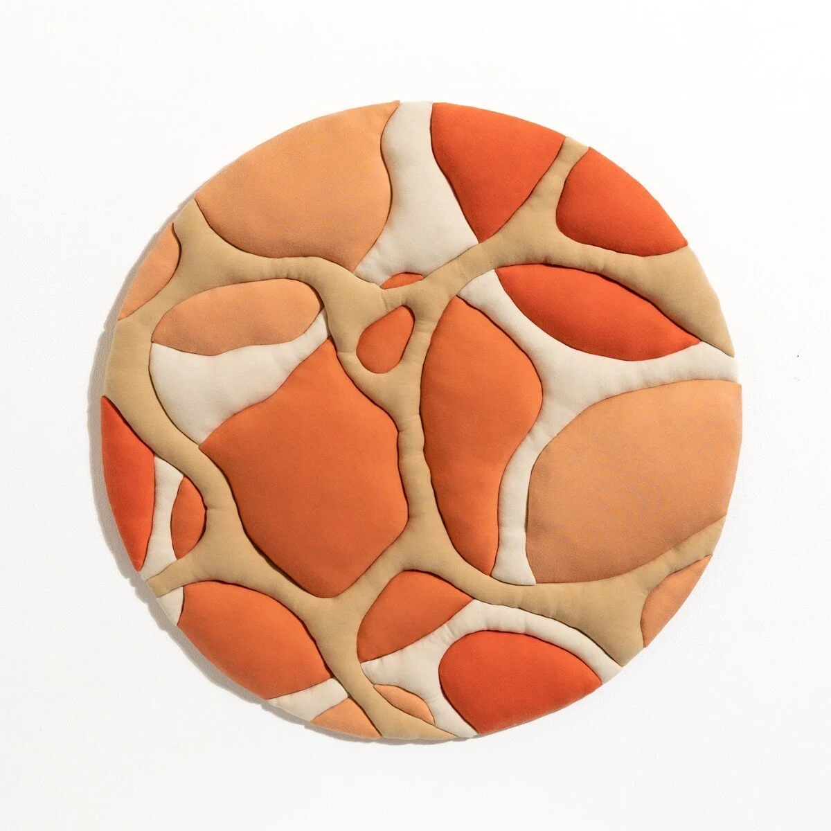 natural fabric textile wall sculpture in organic shapes by Sienna Marts @ Soapbox Arts Gallery in Burlington, Vermont