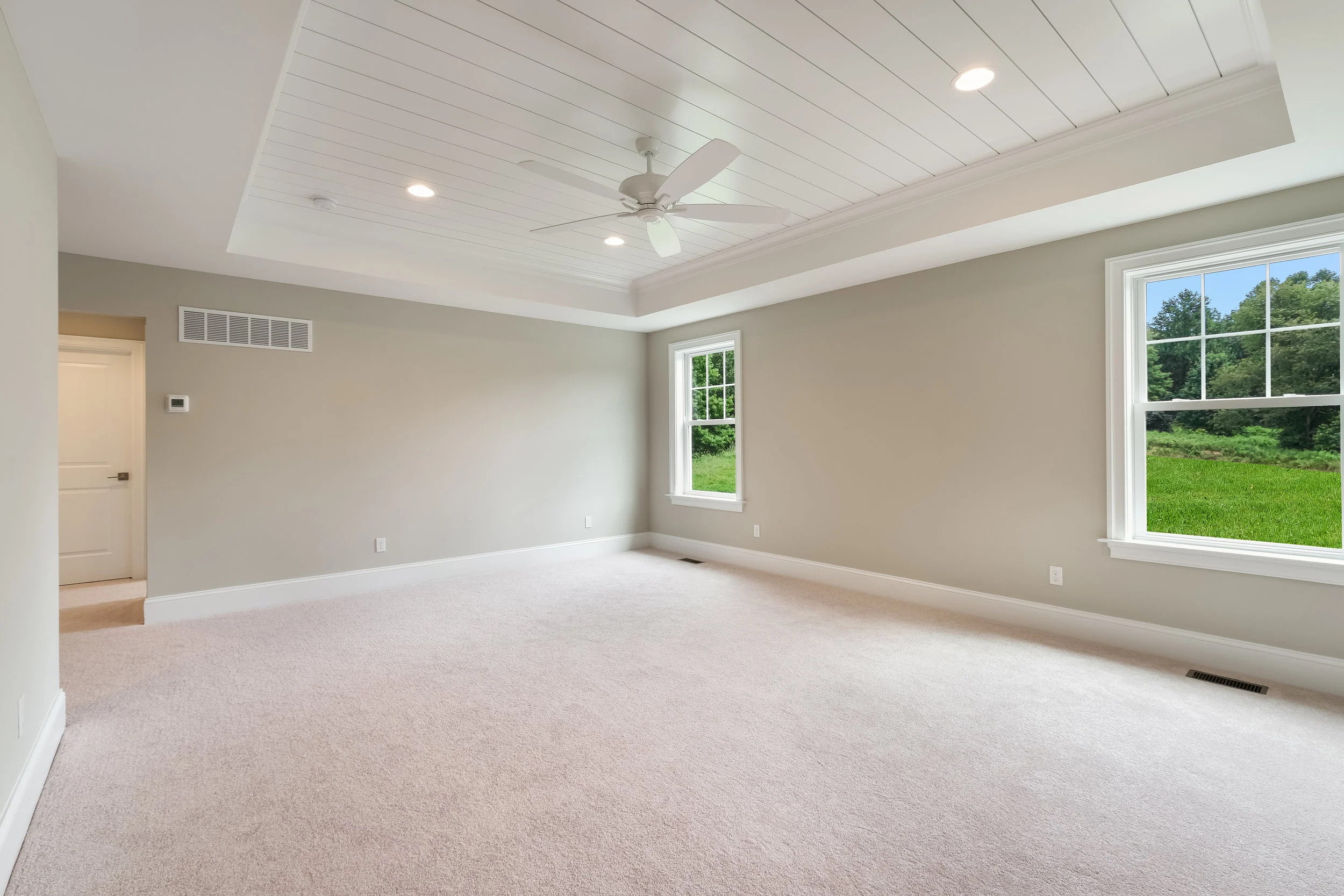 Breathtaking Master Retreat with Shiplap Tray Ceiling, En Suite 4-Piece Bath, and Extravagant Walk-In Closet