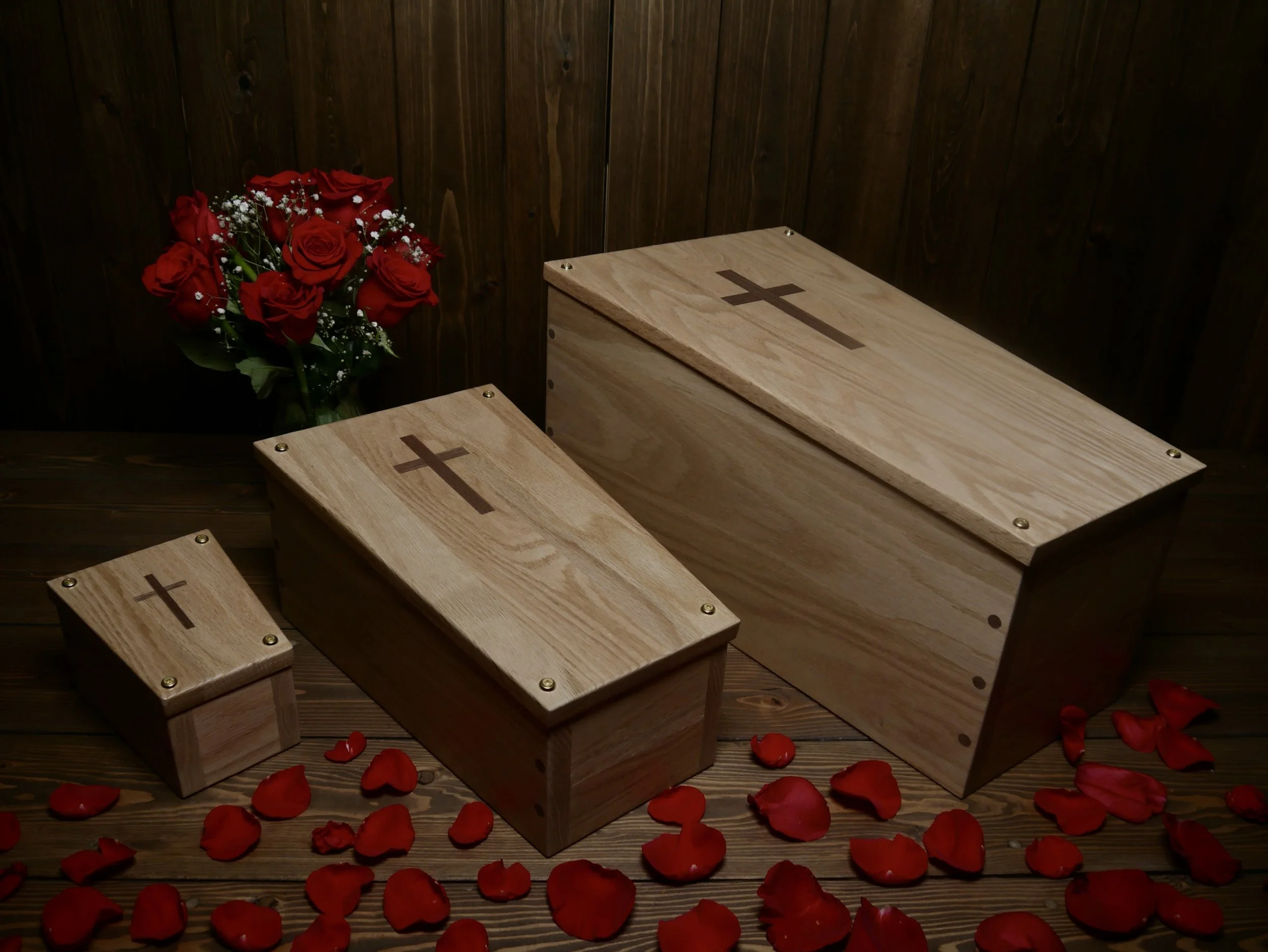 3 trimester caskets with roses.jpeg